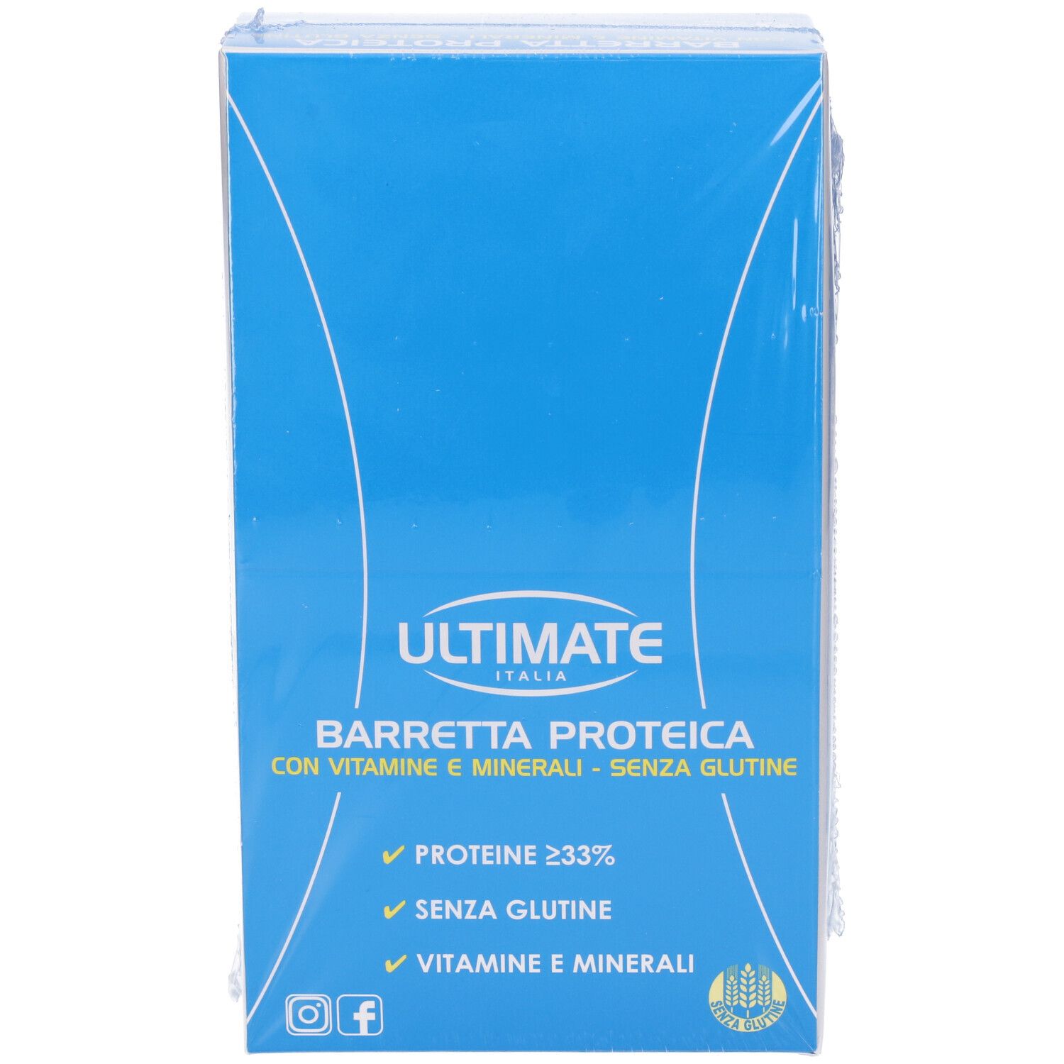 Scatola blu con barrette proteiche. Scritta: ULTIMATE, BARRETTA PROTEICA, proteine ≥ 33%, vitamine e minerali, senza glutine.
