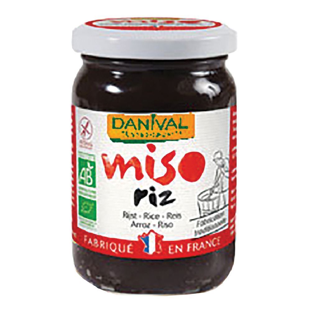 Vasetto di Miso Di Riso Bio. Etichetta con logo, testo e illustrazione. Coperchio bianco con scritta rossa.