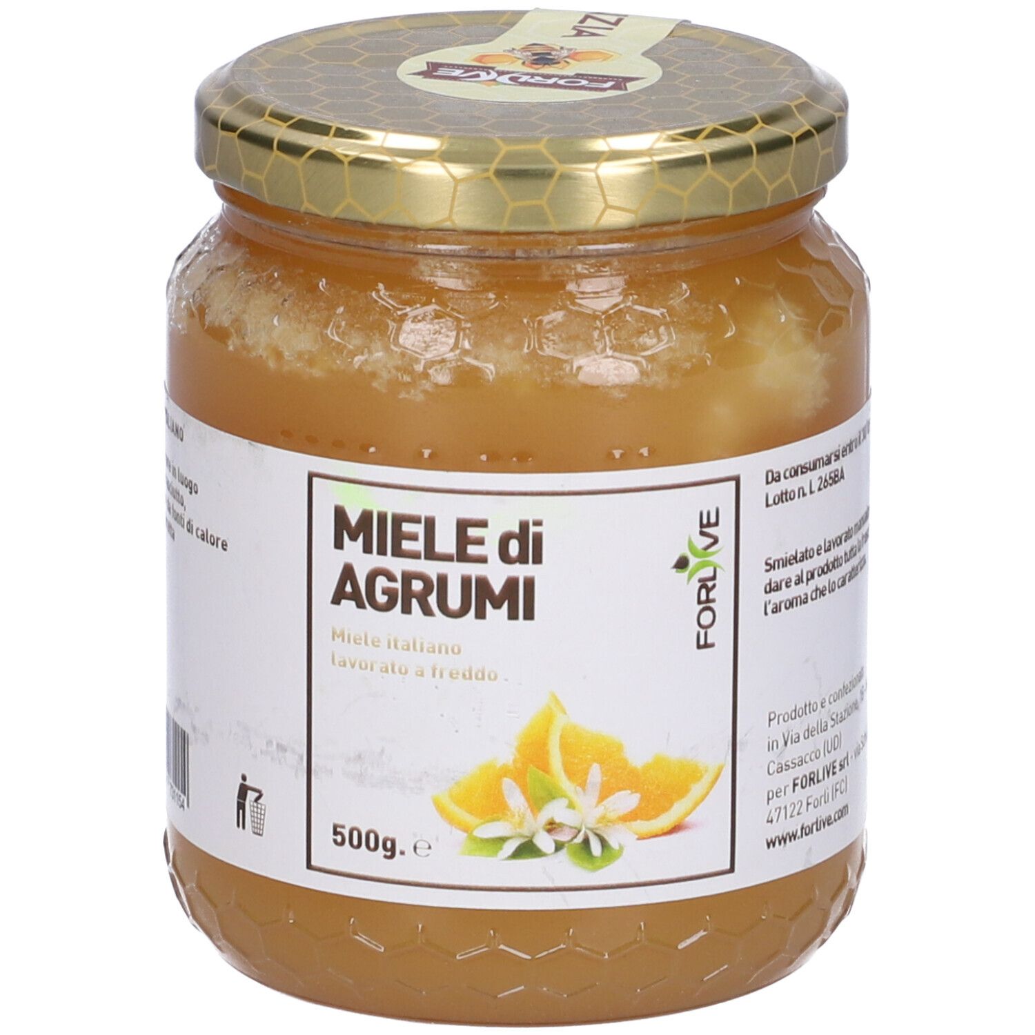 Vasetto di miele. Etichetta con "Miele di Agrumi" e illustrazione di arance. Coperchio dorato.