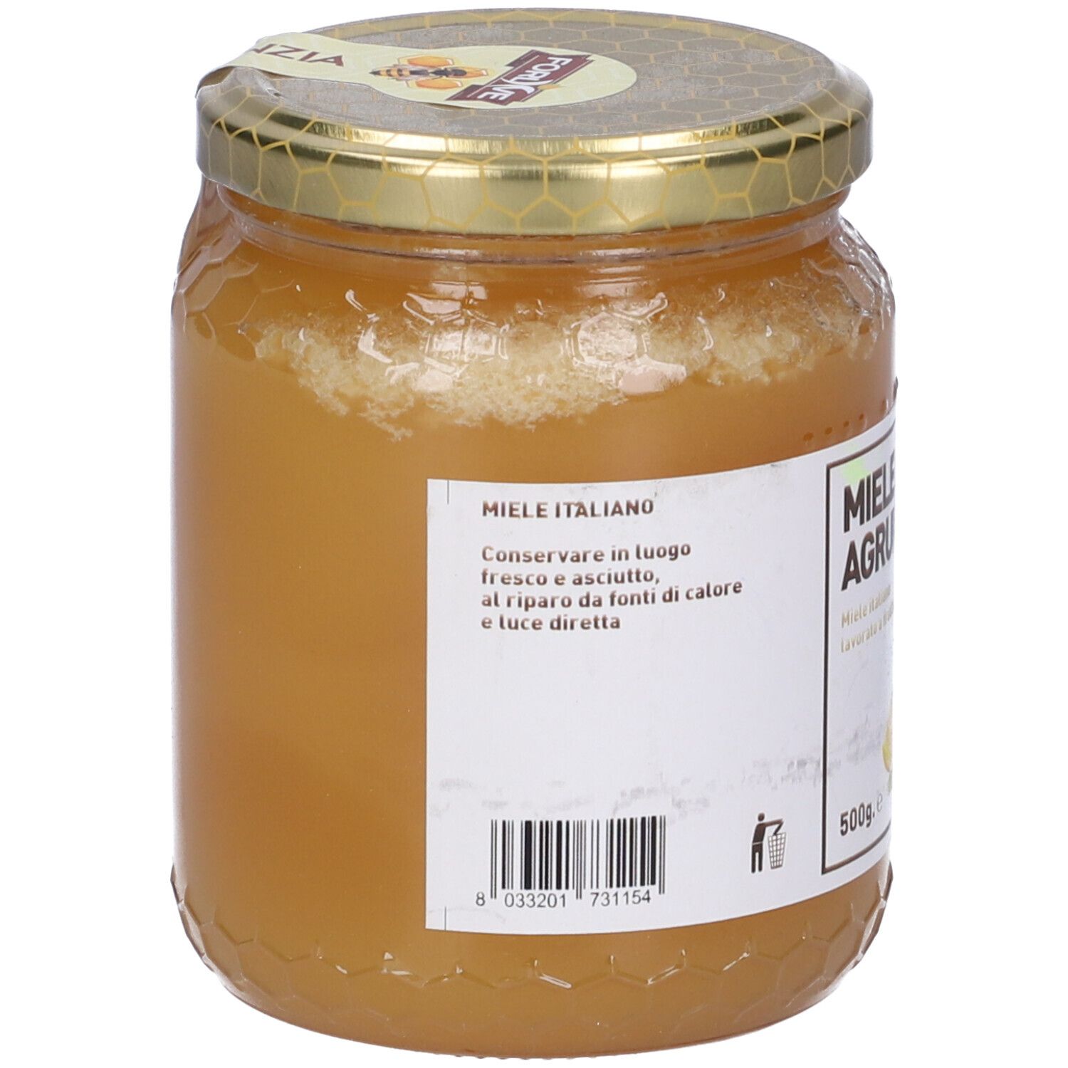 Vasetto di miele. Retro con etichetta e codice a barre. Coperchio dorato.