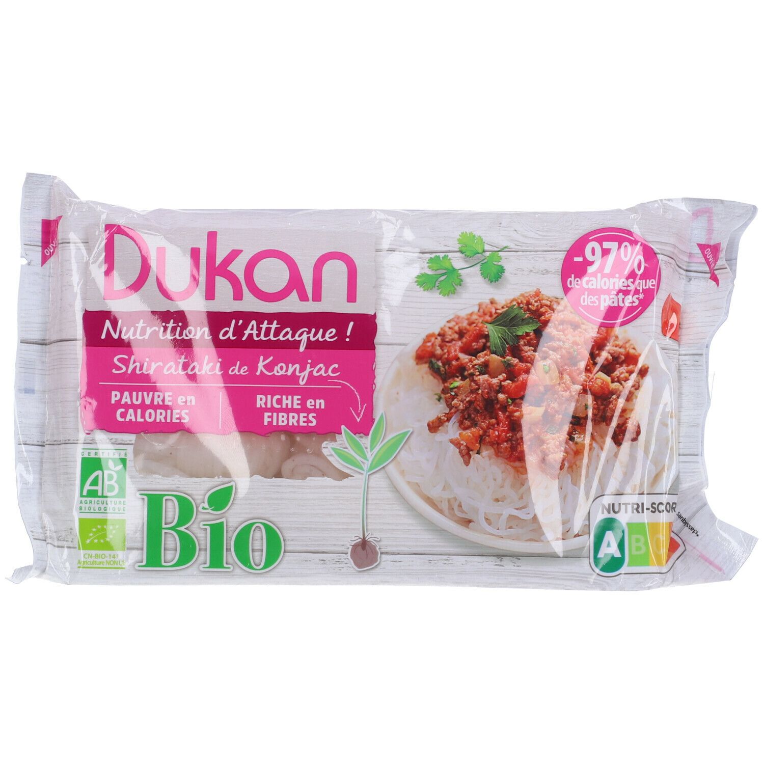 Confezione di Shirataki de Konjac Dukan. Scritte: Bio, -97% calorie, ricco di fibre. Immagine di noodles con salsa.