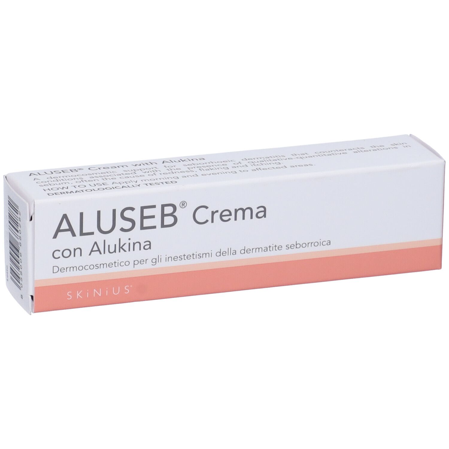 Boîte. Inscription: ALUSEB® Crema con Alukina. Blanc avec accents roses. Dermocosmétique.