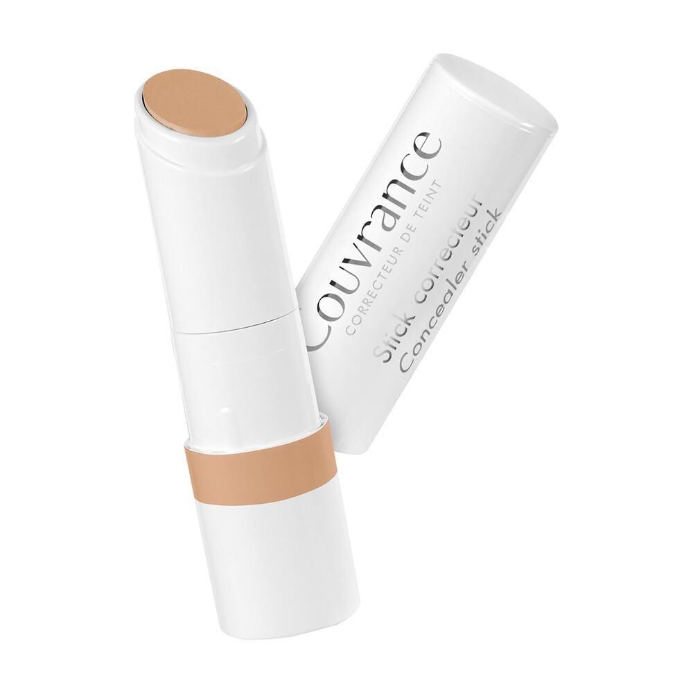 Stick correttore bianco con punta e base color corallo. Scritta Couvrance.