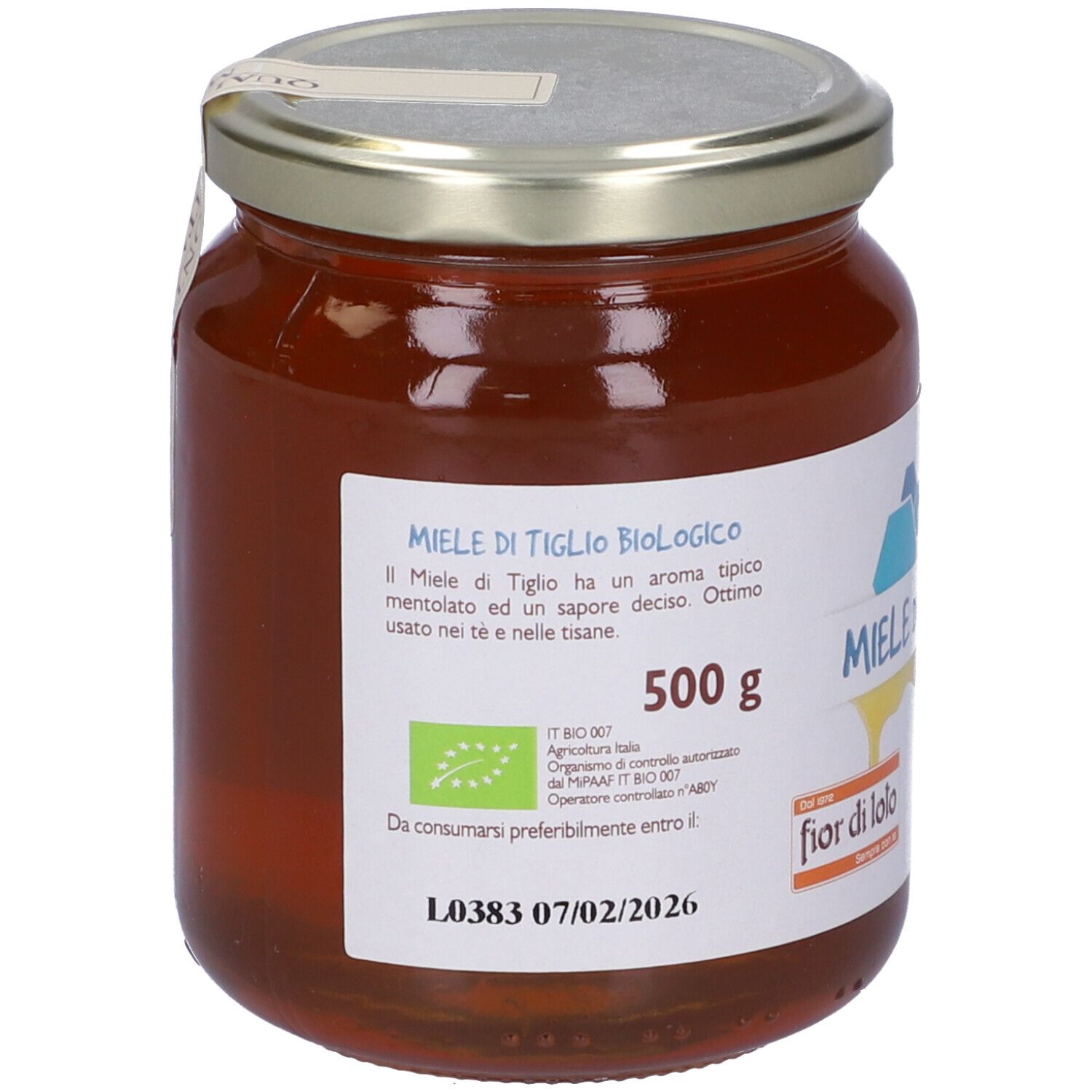 Vasetto di miele. Etichetta con testo: Miele di Tiglio, fior di lolo, 500g, Origine Italia, marchio bio.