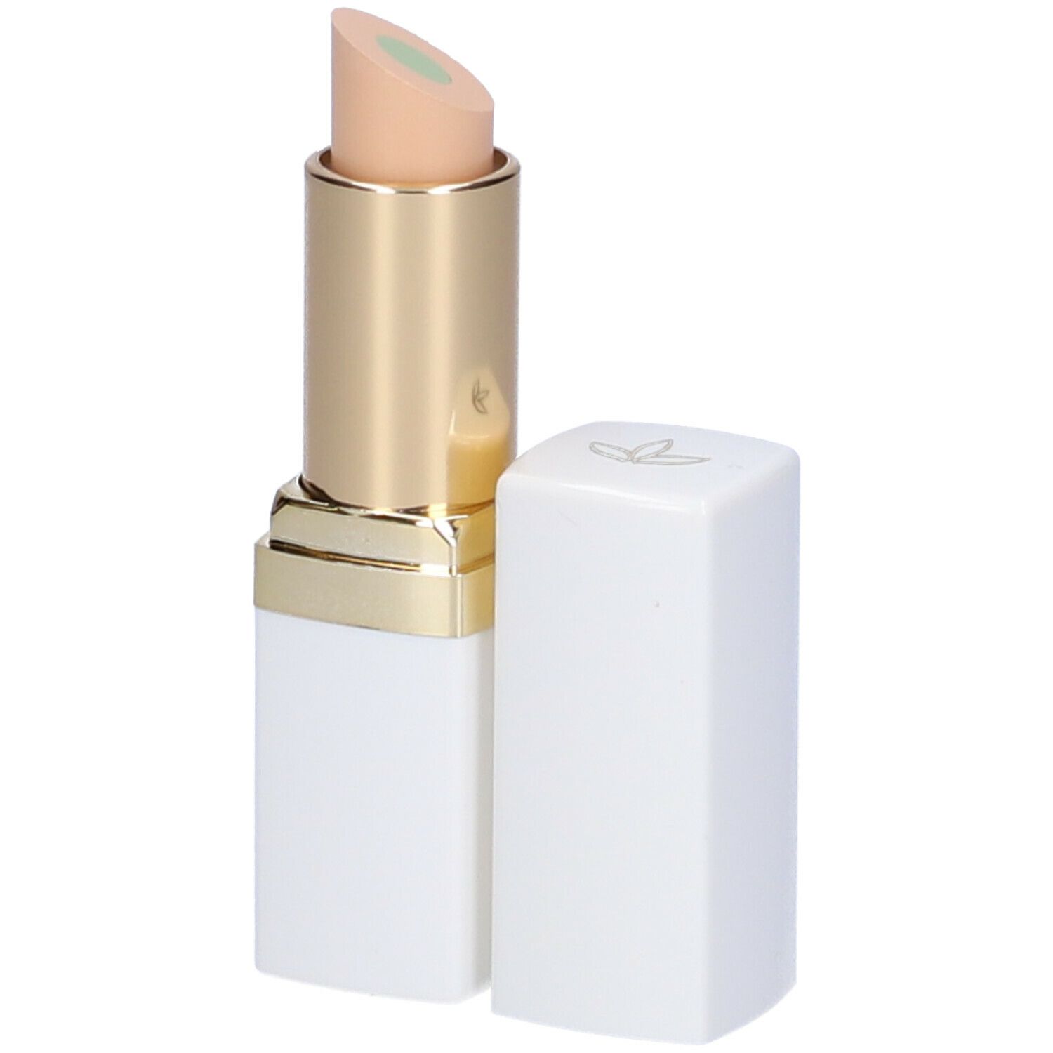 Stick correttore bianco con anello dorato e punta verdastra. Tappo accanto.