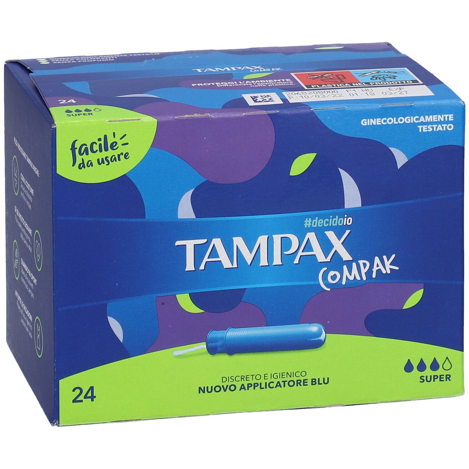 Tampax Compak Super-Verpackung. Blaue Schachtel mit 24 Stück. Aufschrift: Tampax Compak, Super. Grüner und blauer Hintergrund.