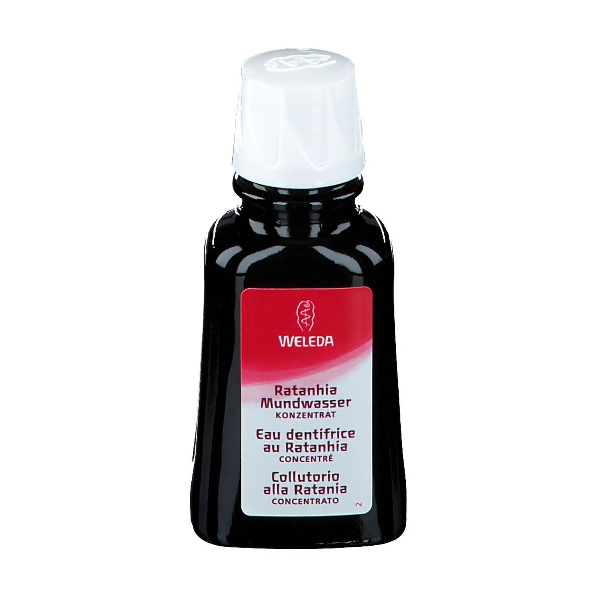 WELEDA Eau dentifrice au Ratanhia. Bouteille avec bouchon blanc. Étiquette rouge avec nom du produit. Liquide noir.