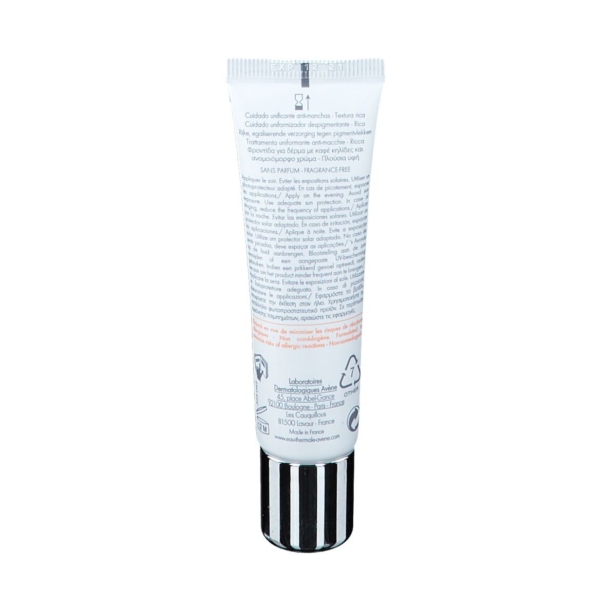 Dos d'un tube blanc avec bouchon rayé noir et blanc. Texte multilingue. Contient des informations sur le produit.
