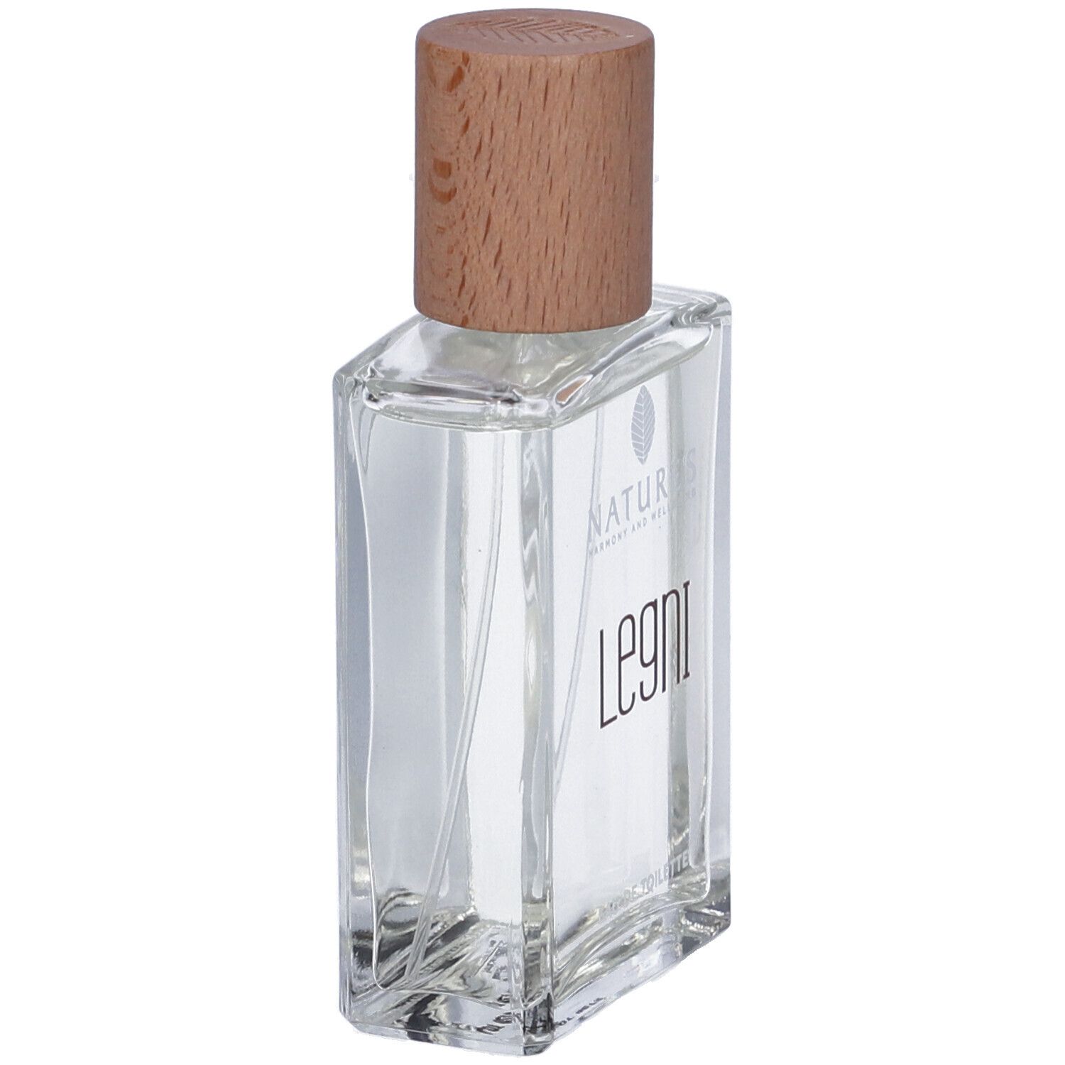 Flacone in vetro con tappo in legno. Scritta: Legni Eau de Toilette. Forma rettangolare. Contenuto trasparente.