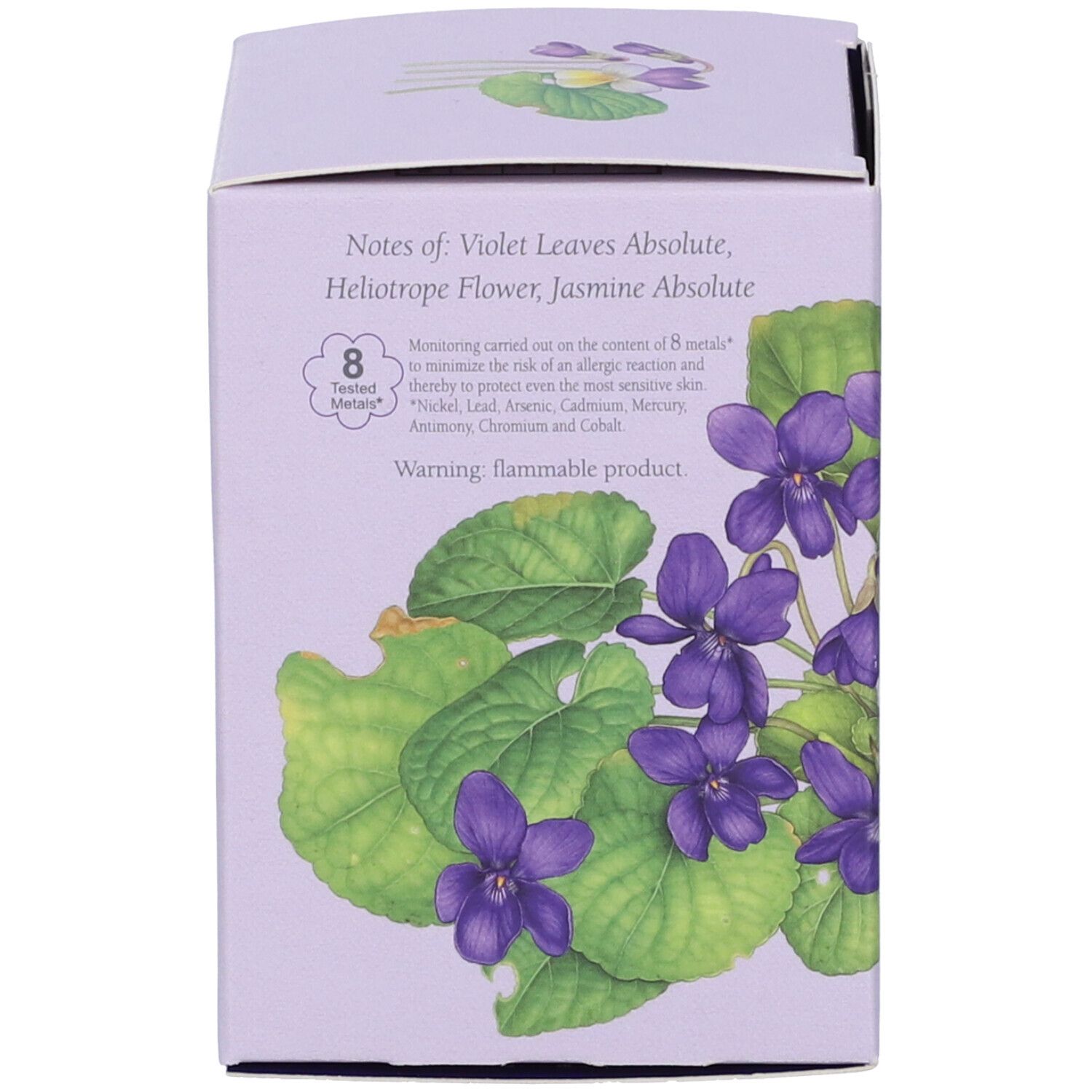 Lila Verpackung mit Veilchen-Illustration. Notizen: Veilchenblätter Absolue, Heliotrop-Blüte, Jasmin Absolue. Warnung: brennbares Produkt.