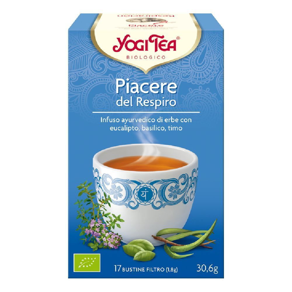 Scatola Yogi Tea blu e bianca. Scritta: Piacere del Respiro. Immagine di una tazza di tè con erbe. 17 bustine filtro.