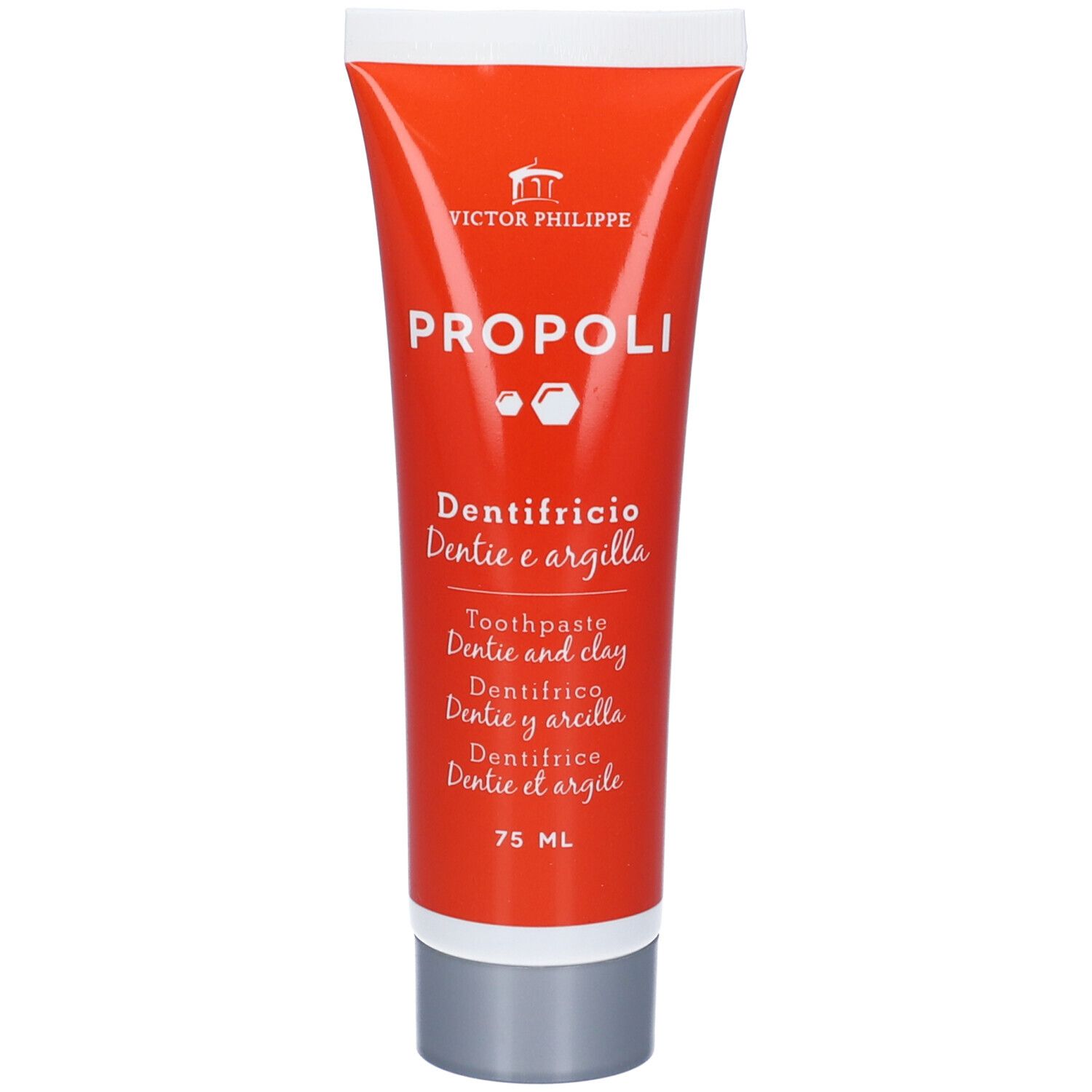 Tubo di dentifricio arancione. Nome del prodotto e logo. Designazioni multilingue. 75 ml.