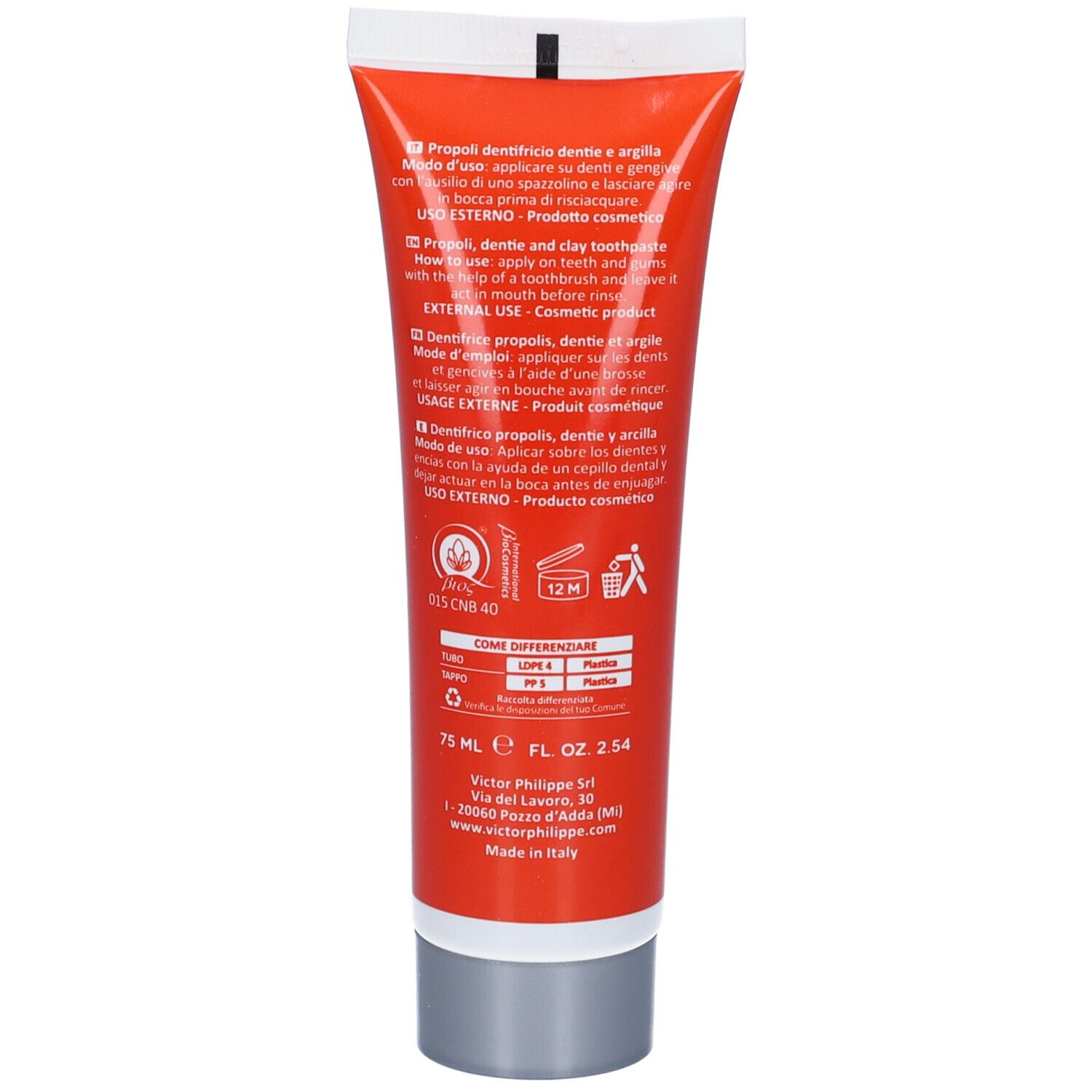 Retro di un tubo di dentifricio arancione. Testo in più lingue. 75 ml.