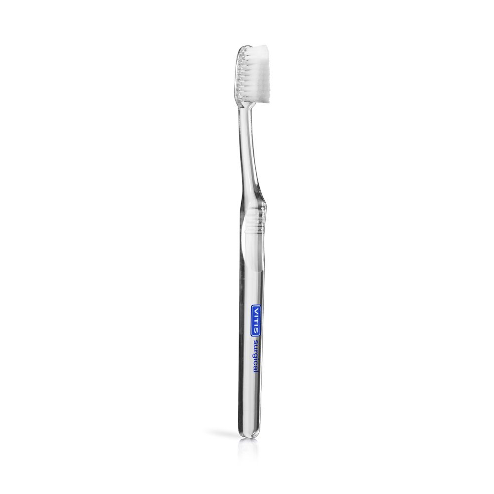 Spazzolino trasparente VITIS surgical. Manico blu. Setole bianche. Forma curva.