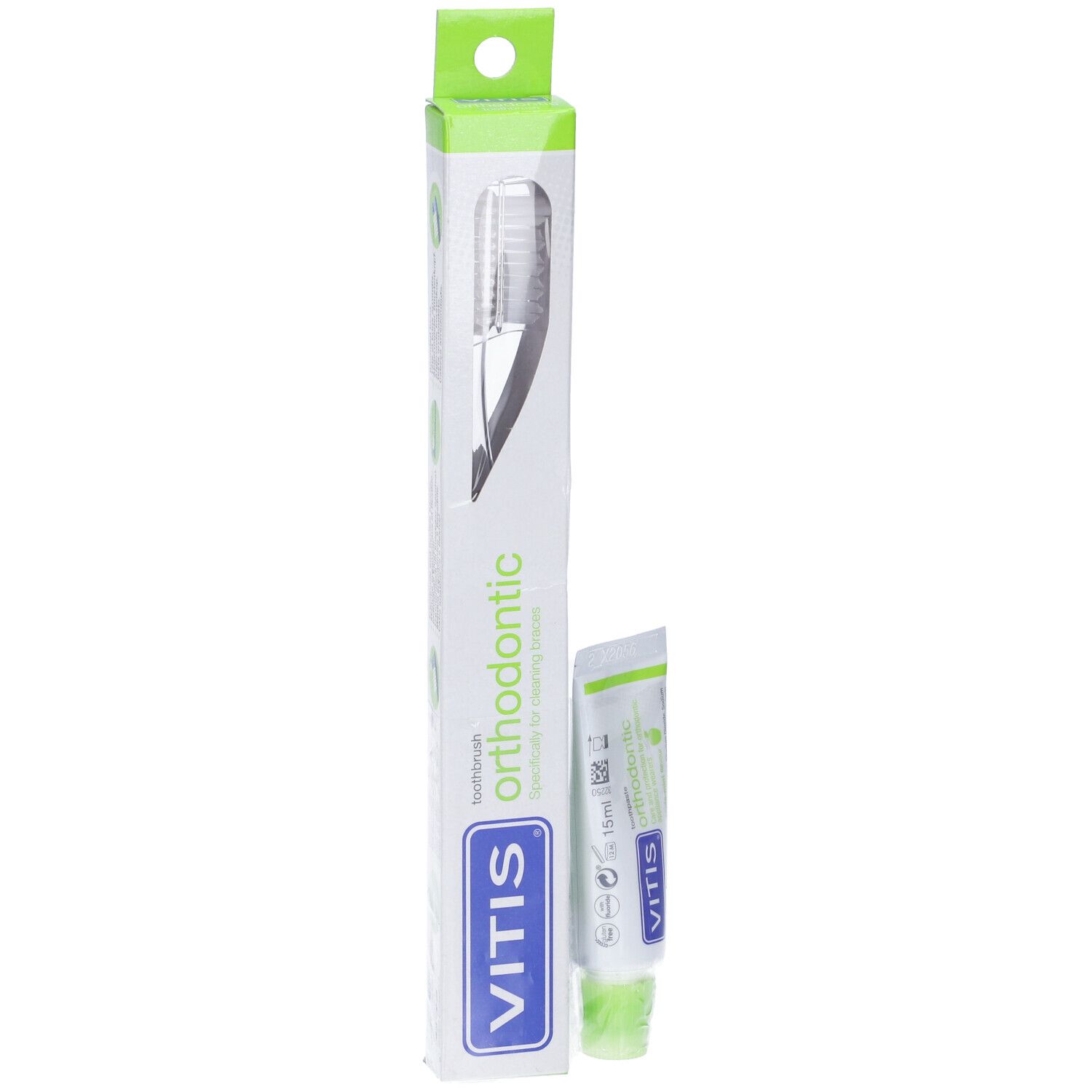 Zahnbürste und Zahnpasta in Verpackung. VITIS orthodontic. Weiß-grüne Tube und Verpackung.