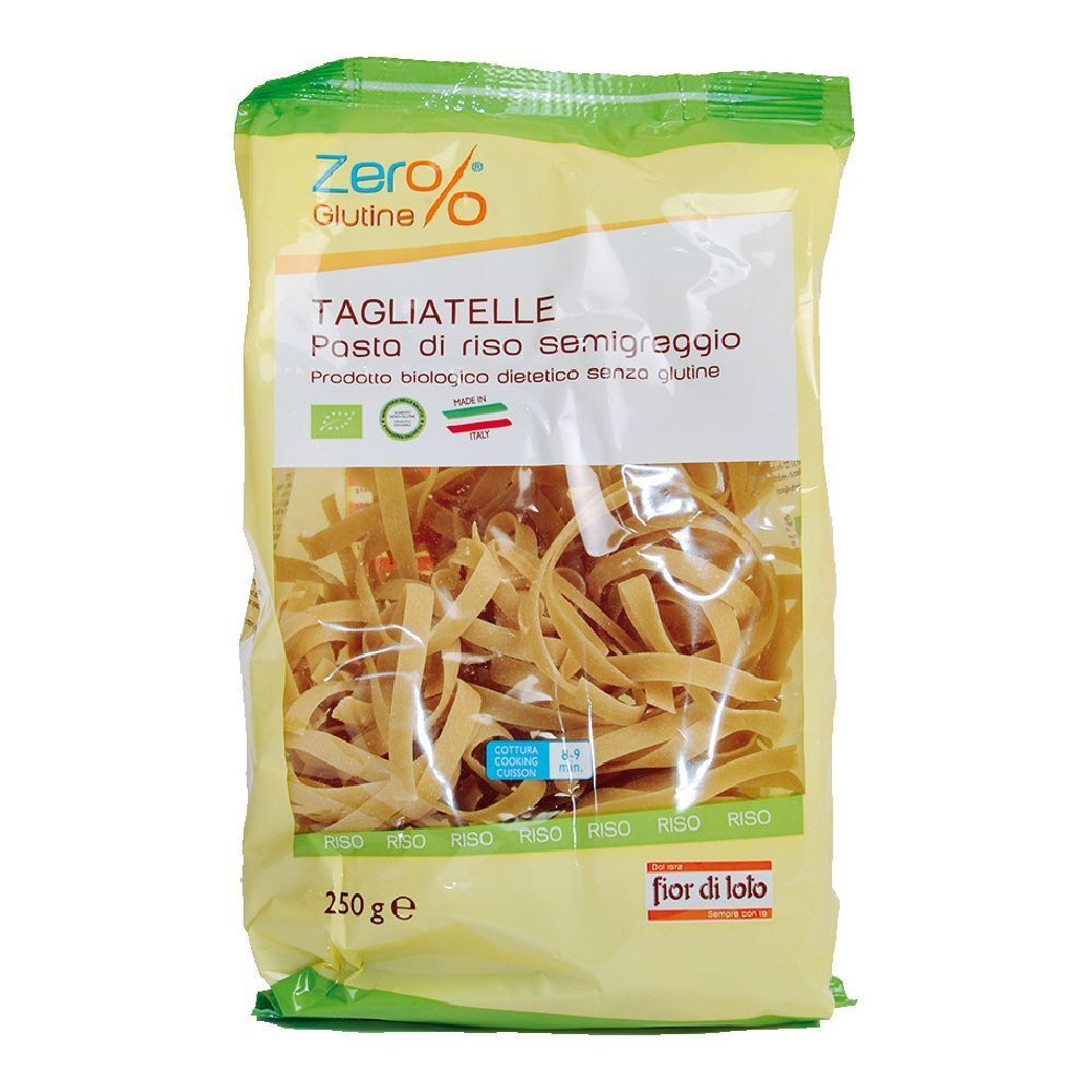Confezione di tagliatelle senza glutine. Confezione giallo-verde, vista trasparente sulla pasta. Scritte: Zero%, Tagliatelle, 250g.