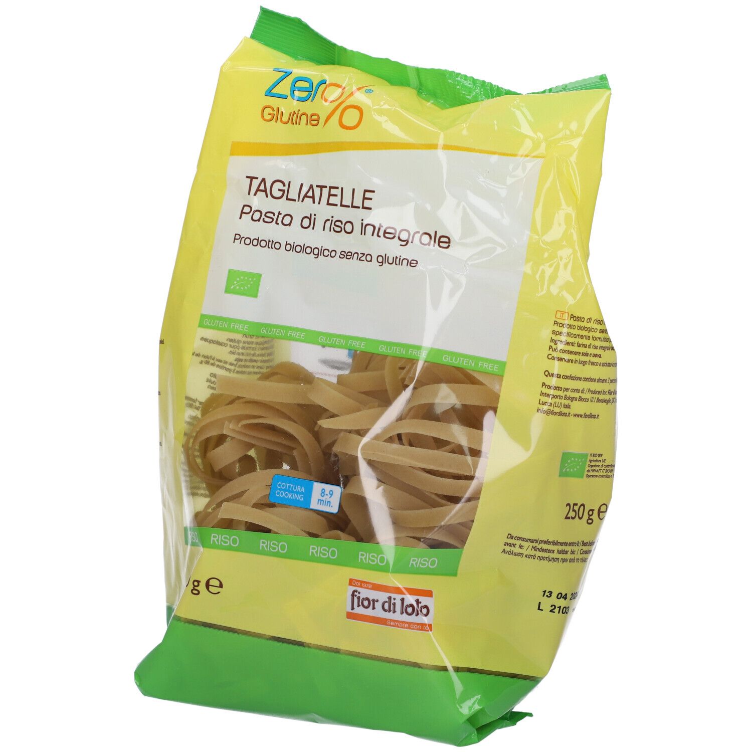 Confezione di tagliatelle integrali senza glutine. Confezione giallo-verde, vista trasparente sulla pasta. Scritte: Zero%, Tagliatelle, 250g.