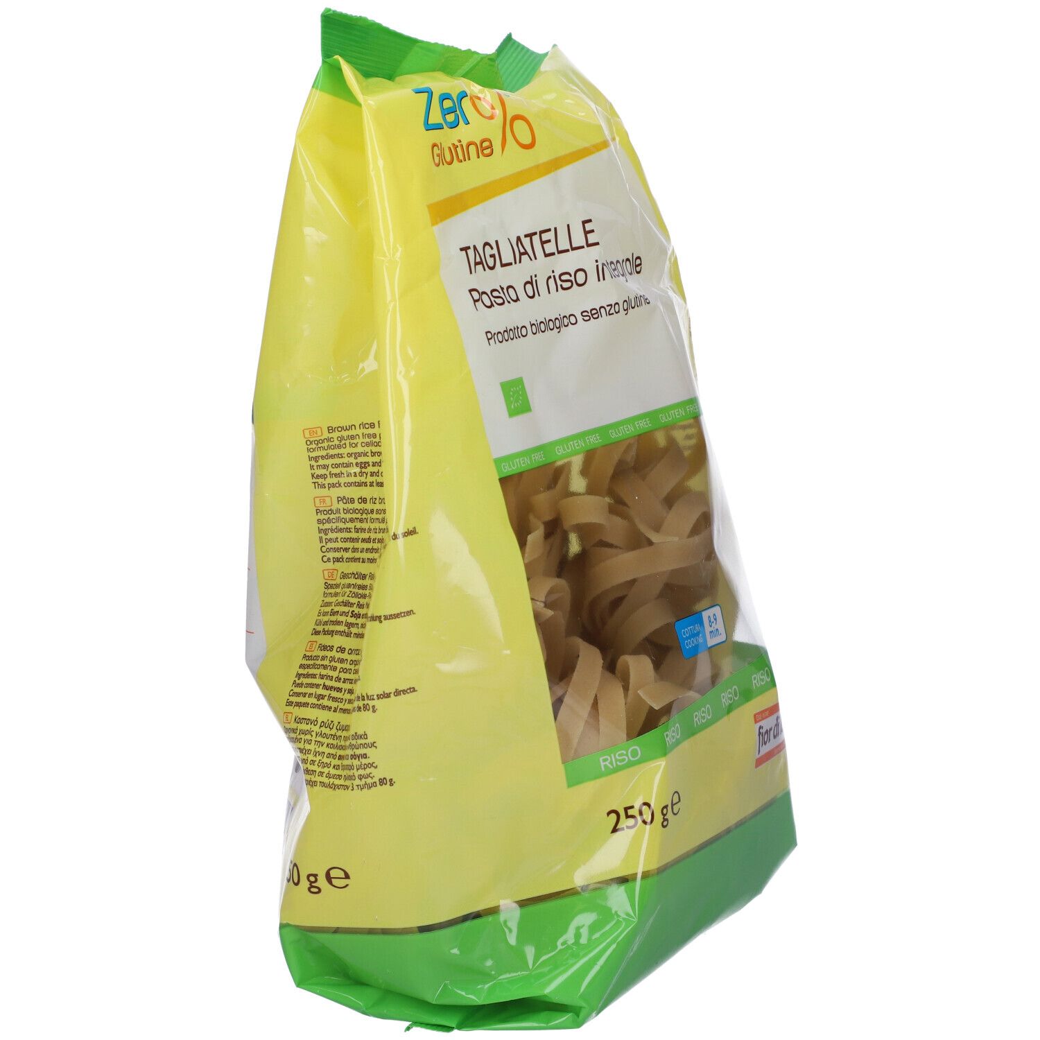 Confezione di tagliatelle integrali senza glutine. Confezione giallo-verde, vista trasparente sulla pasta. Scritte: Zero%, Tagliatelle, 250g.