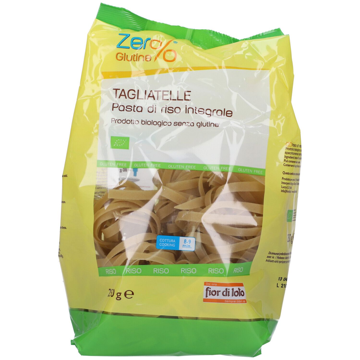 Confezione di tagliatelle integrali senza glutine. Confezione giallo-verde, vista trasparente sulla pasta. Scritte: Zero%, Tagliatelle, 250g.