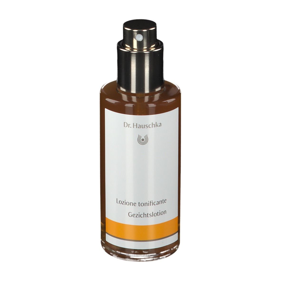Flacone di vetro marrone con vaporizzatore. Etichetta con testo: Gesichtstonikum. Marchio: Dr. Hauschka.