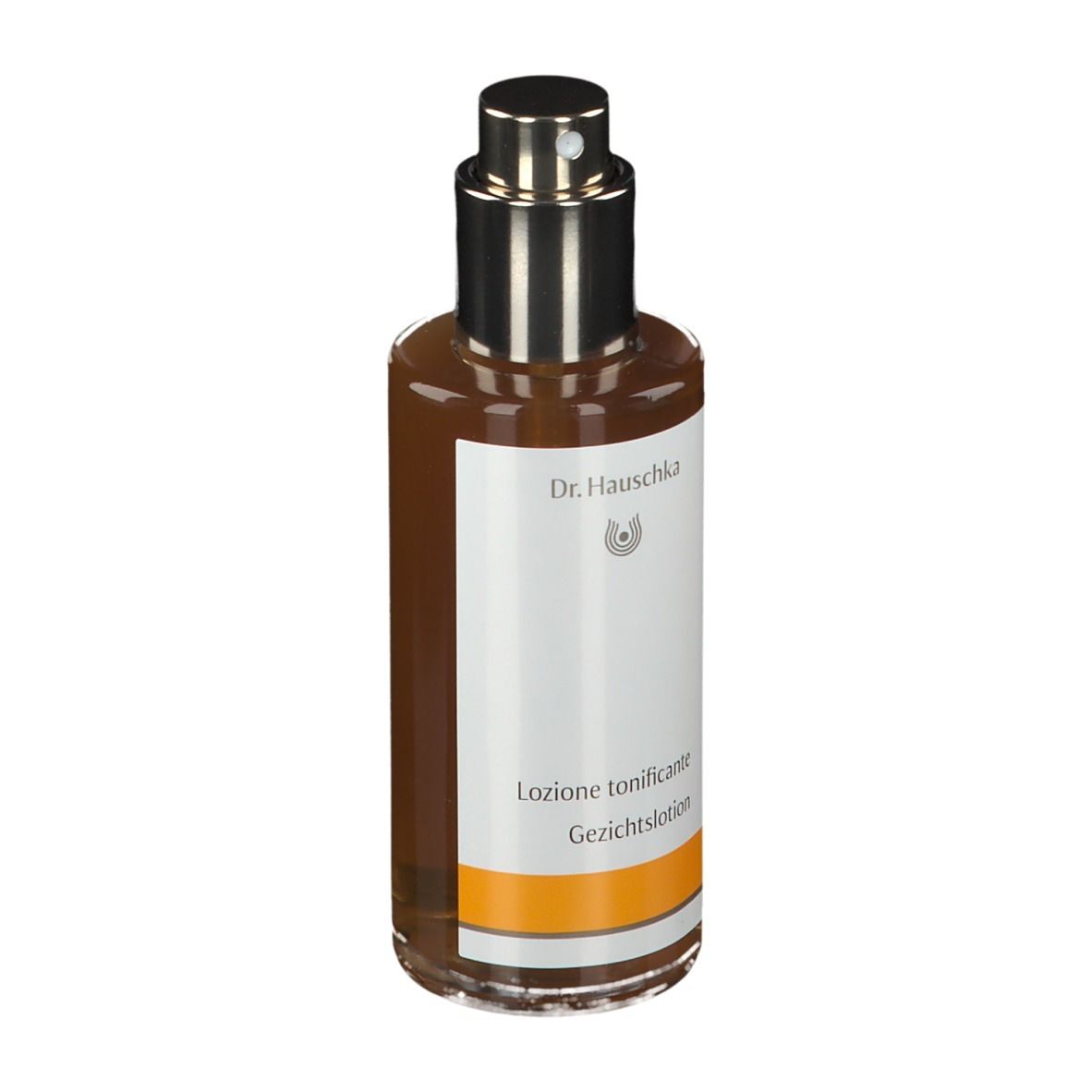 Flacone di vetro marrone con vaporizzatore. Etichetta con testo: Gesichtstonikum. Marchio: Dr. Hauschka.