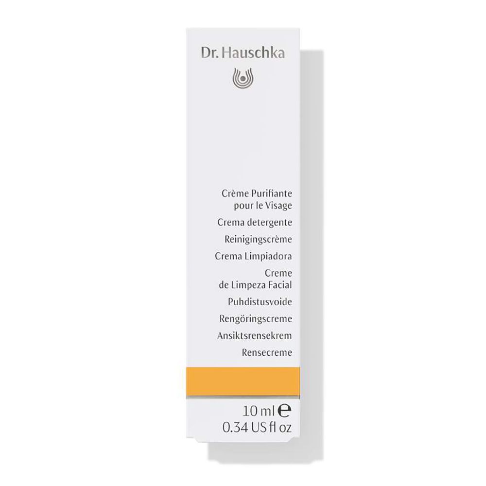 Confezione bianca con fascia gialla. Scritta: Crème Purifiante, 10 ml, Dr. Hauschka.