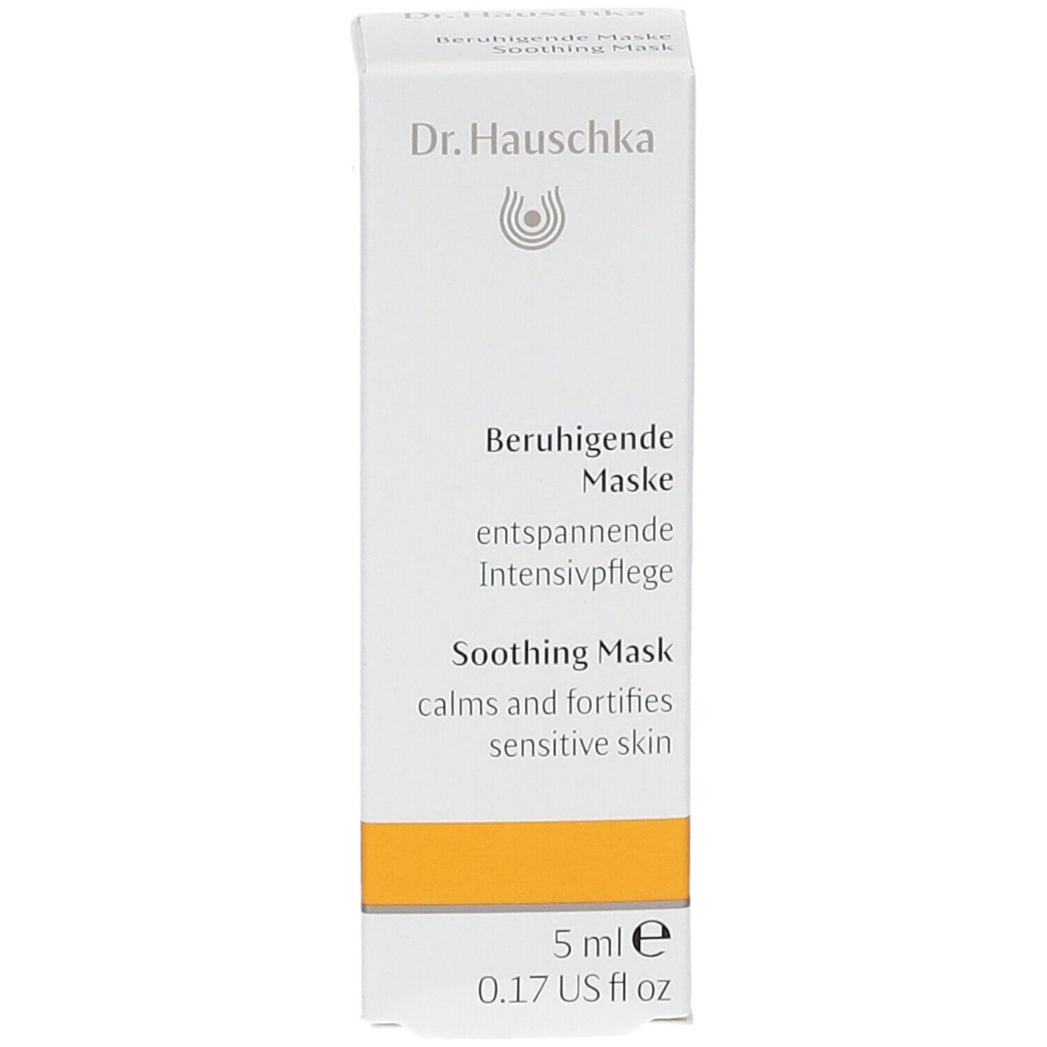 Scatola con prodotto. Scritta: Dr. Hauschka, Beruhigende Maske, Soothing Mask. 5 ml. Striscia gialla.