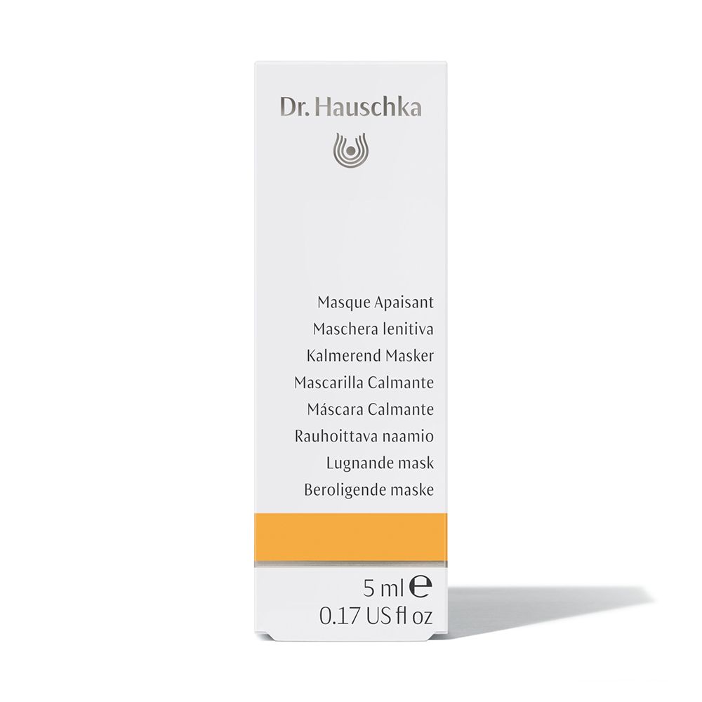 Scatola con prodotto. Scritta: Dr. Hauschka, Masque Apaisant, Kalmerend Masker, etc. 5 ml. Striscia gialla.