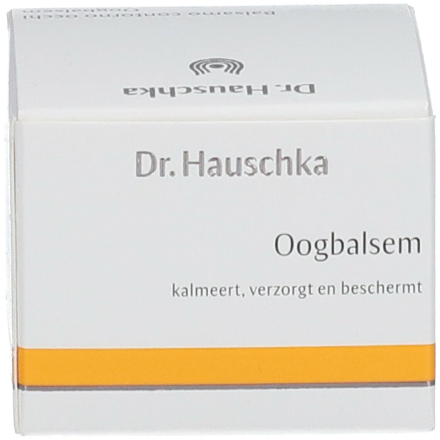 Scatola bianca con fascia gialla. Scritta: Dr. Hauschka, Oogbalsem.