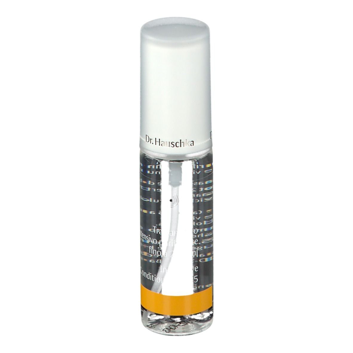 Flacone trasparente con vaporizzatore. Scritta: Dr. Hauschka. Striscia gialla. Etichetta con testo.