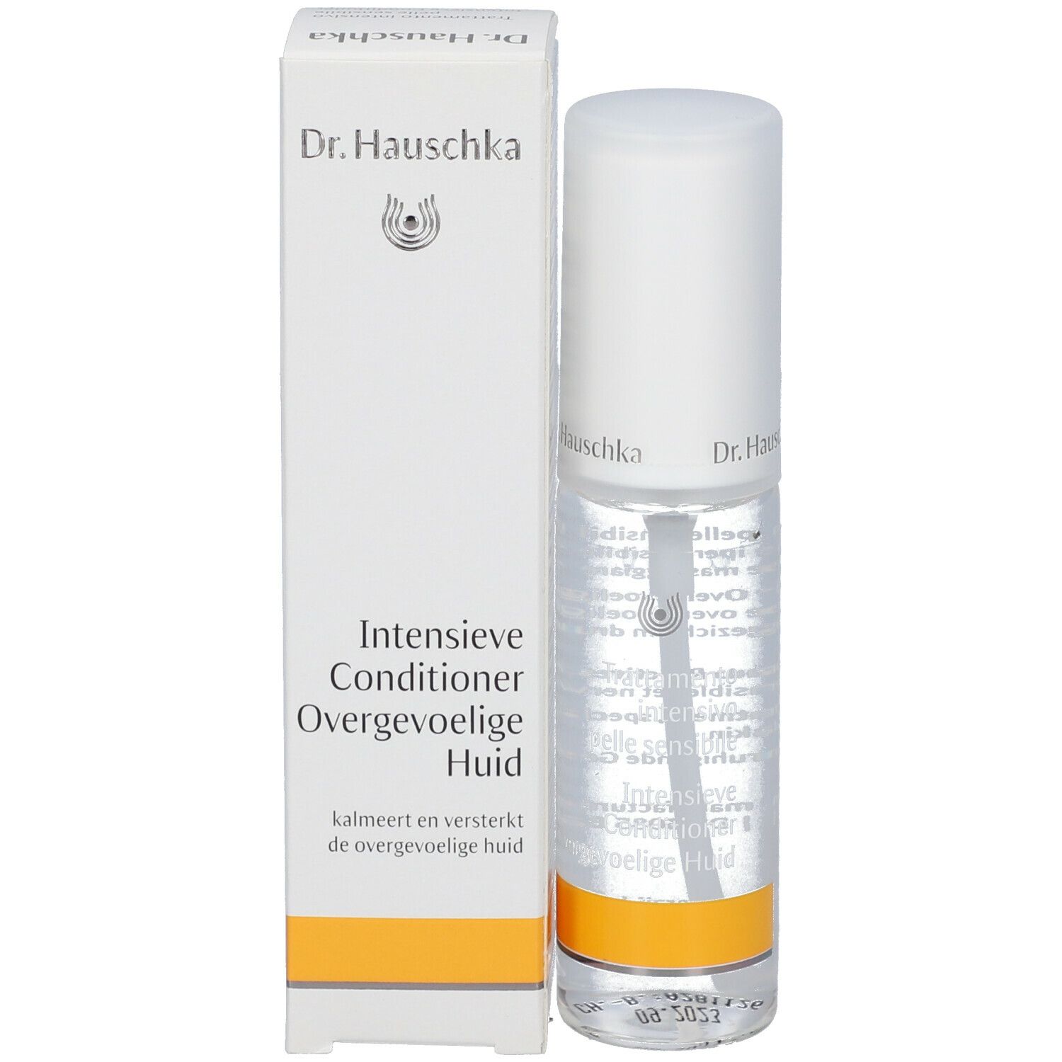 Flacone trasparente con erogatore spray e confezione bianca. Scritte: Dr. Hauschka, Intensieve Conditioner, Overgevoelige Huid.