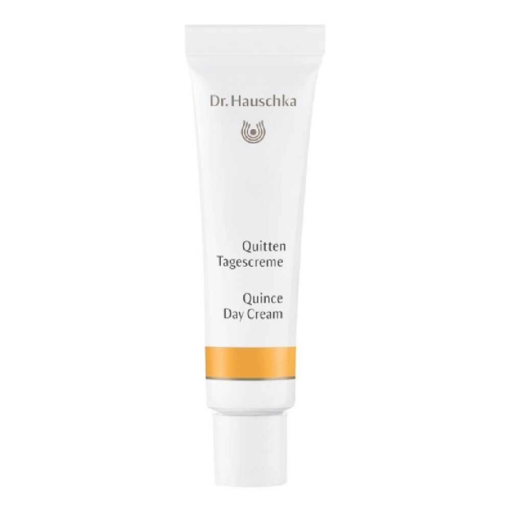 Tubo bianco di Crema giorno al cotogno. Marchio Dr. Hauschka. Striscia gialla. Testo inglese.