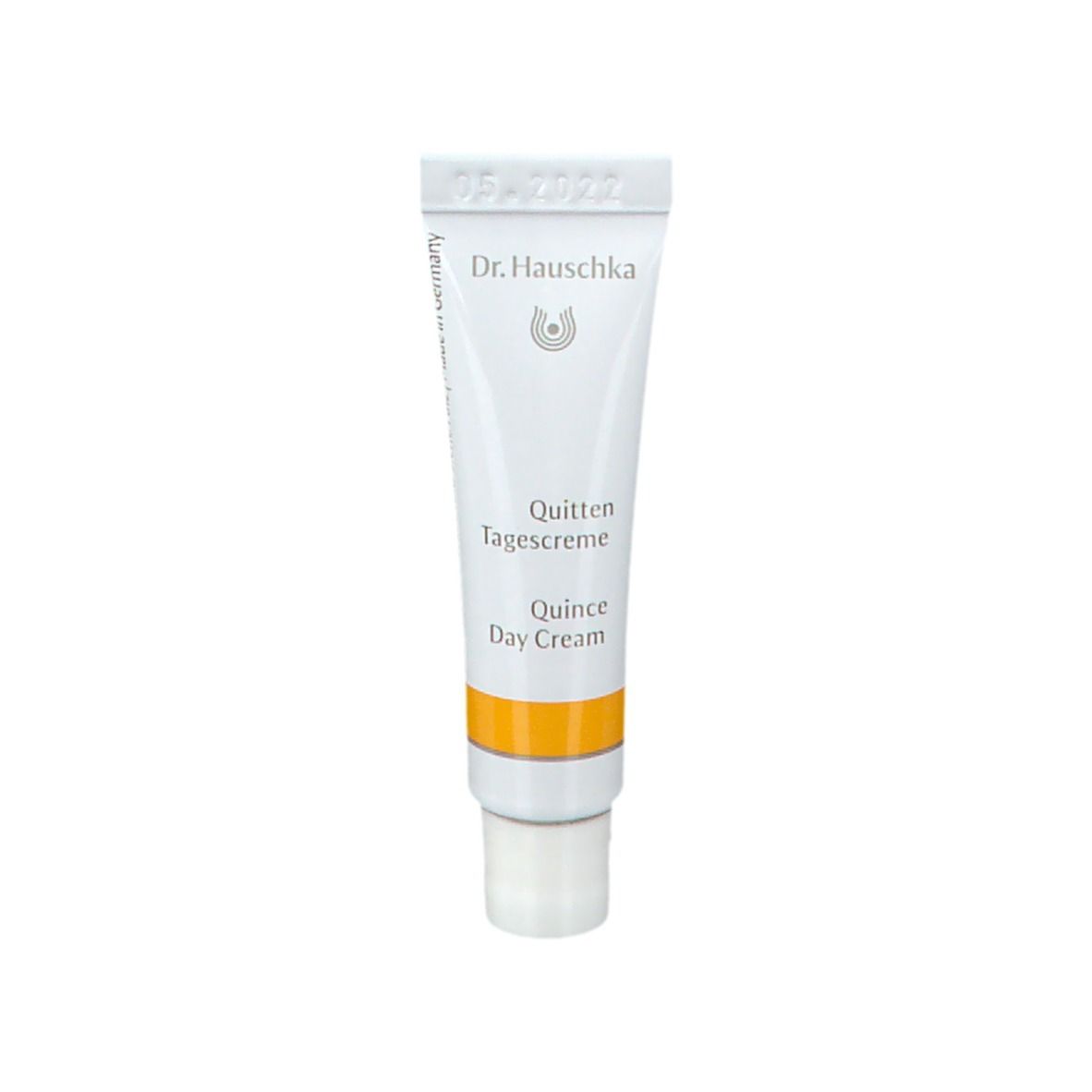 Piccolo tubo di Crema giorno al cotogno. Marchio Dr. Hauschka. Striscia gialla. 5 ml. Data.