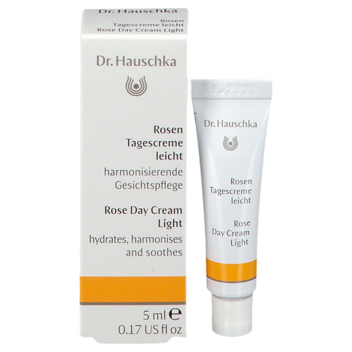 Prodotto e confezione. Tubo bianco e scatola con Dr. Hauschka, Rosen Tagescreme leicht.