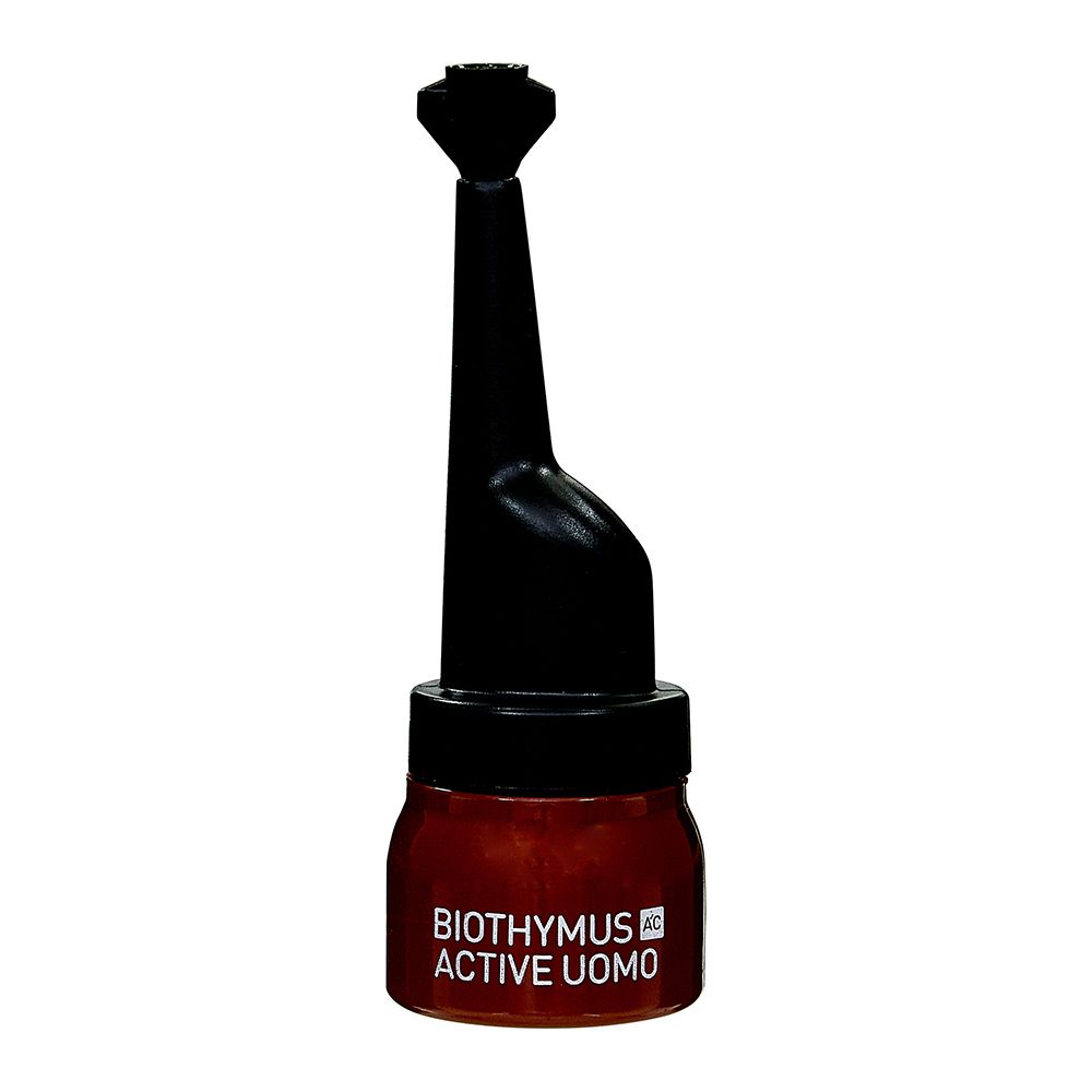 Ampoule marron avec applicateur noir. Inscription: Biothymus Active Uomo.