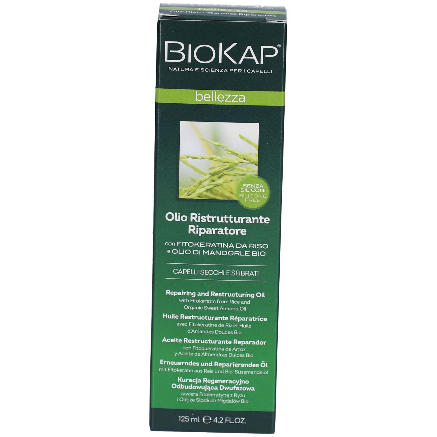 Emballage du produit. Inscription: BIOKAP, Olio Ristrutturante Riparatore. Pour cheveux secs et cassants.