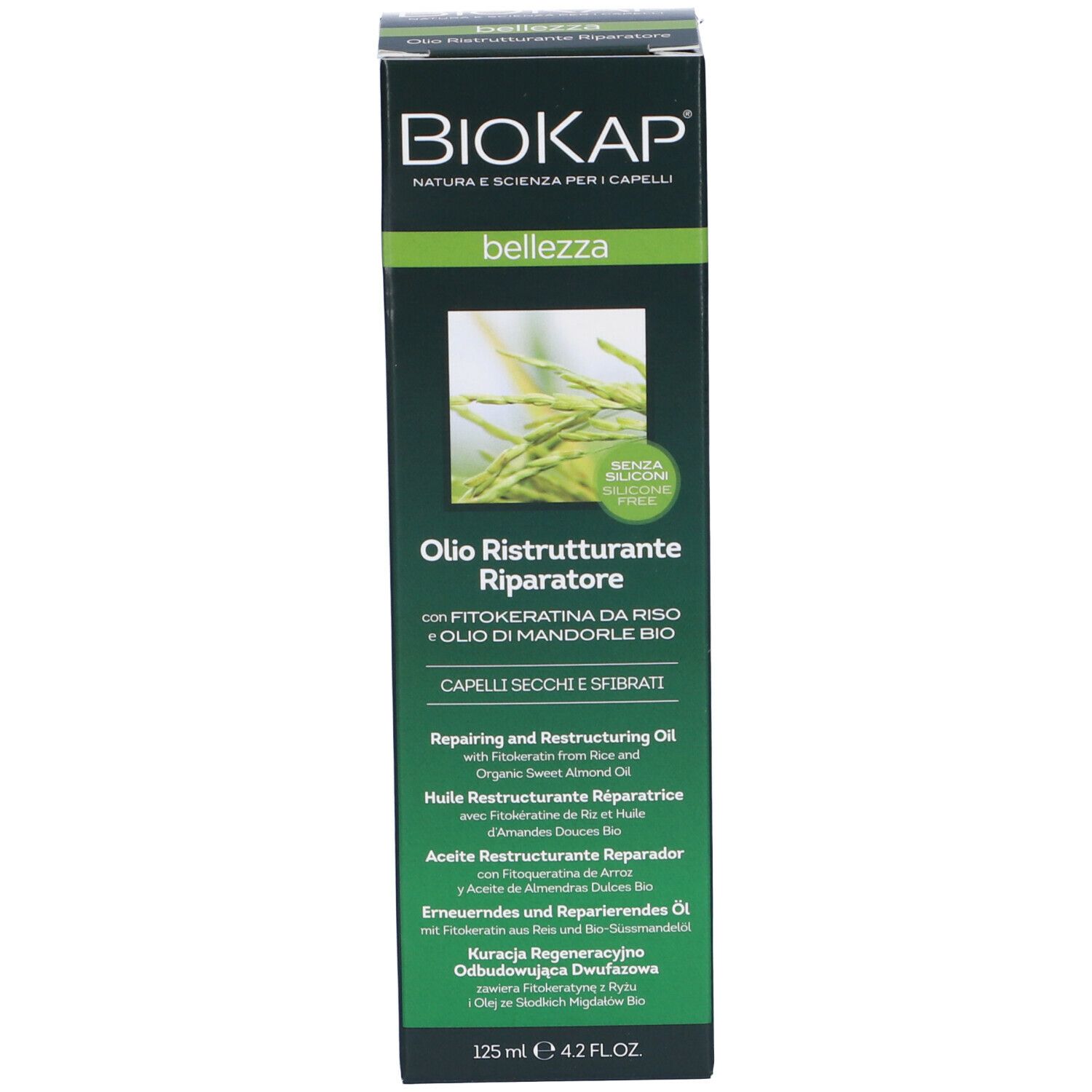 Emballage du produit. Inscription: BIOKAP, Olio Ristrutturante Riparatore. Pour cheveux secs et cassants.