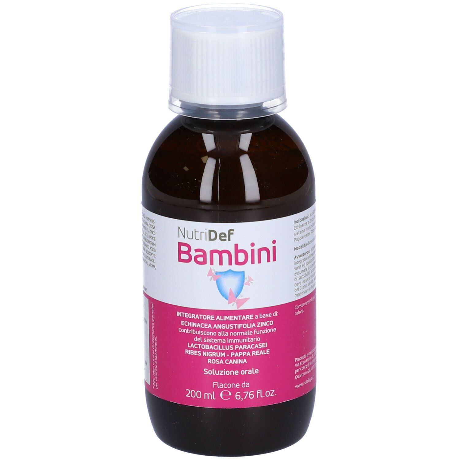 Flacone marrone con tappo bianco. Scritta Nutridef Bambini. Etichetta rosa con informazioni.