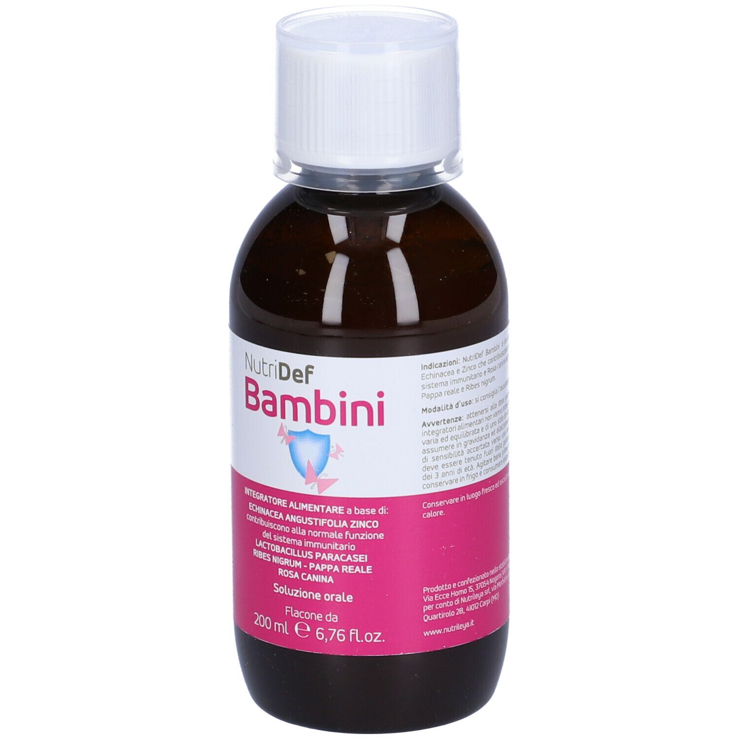 Flacone marrone con tappo bianco. Scritta Nutridef Bambini. Etichetta rosa con informazioni.
