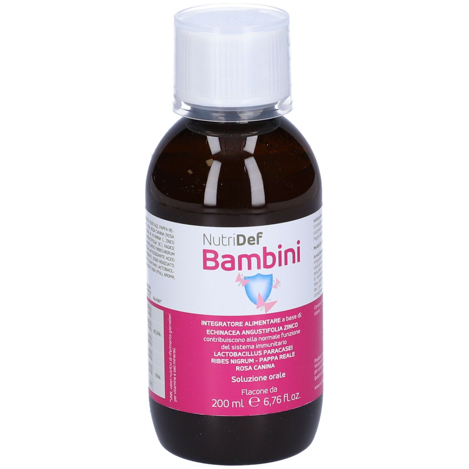 Flacone marrone con tappo bianco. Scritta Nutridef Bambini. Etichetta rosa con informazioni.