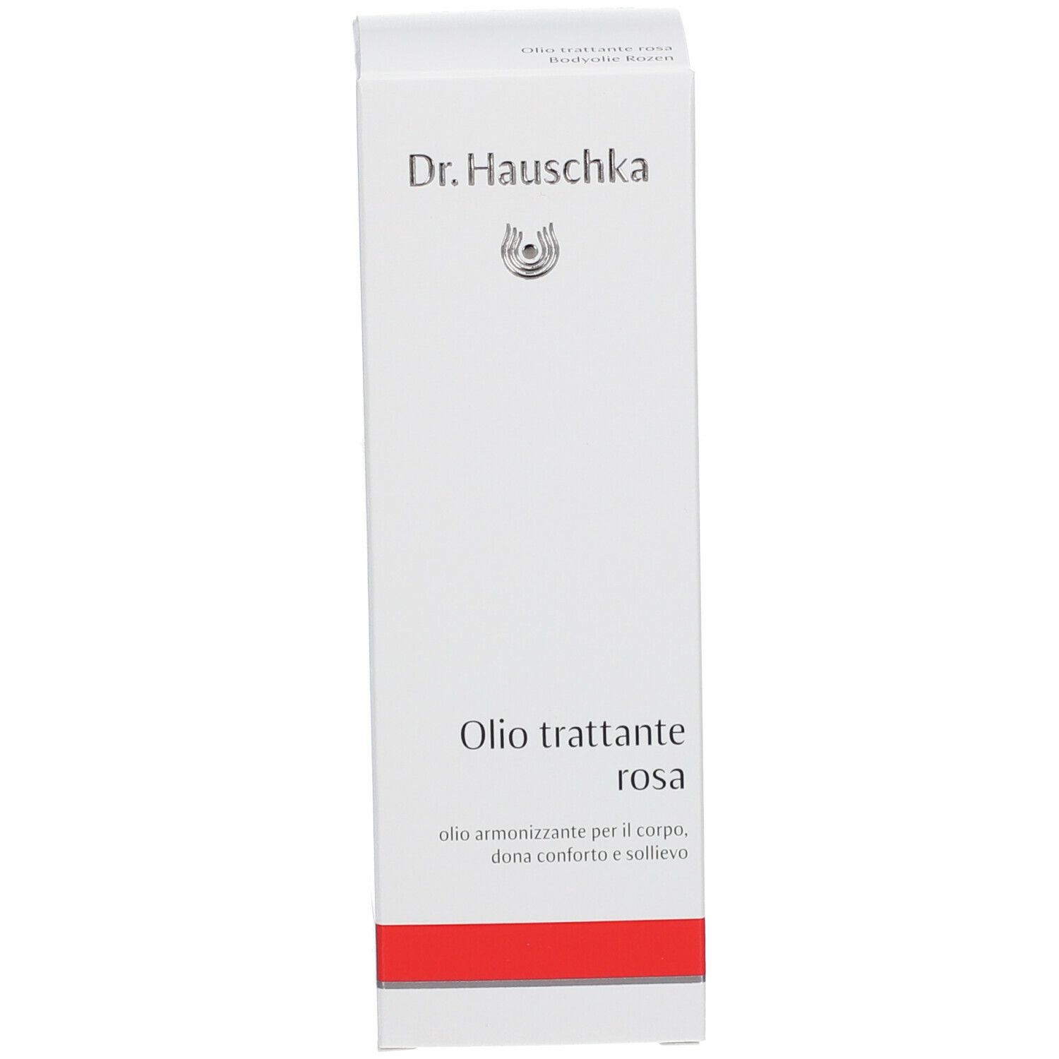 Confezione bianca con logo Dr. Hauschka. Testo: Olio trattante rosa. Striscia rossa in basso.