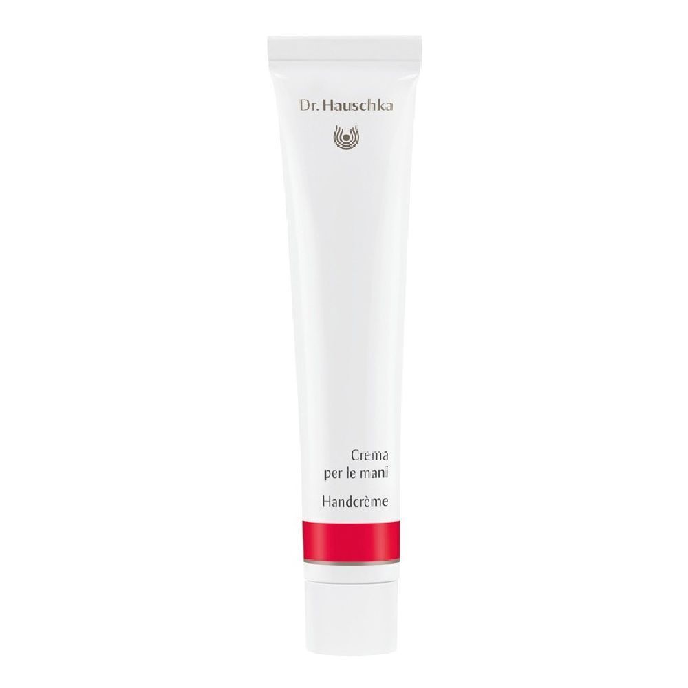 Tubo bianco con fascia rossa. Scritta: Dr. Hauschka, Crema per le mani, Handcreme.