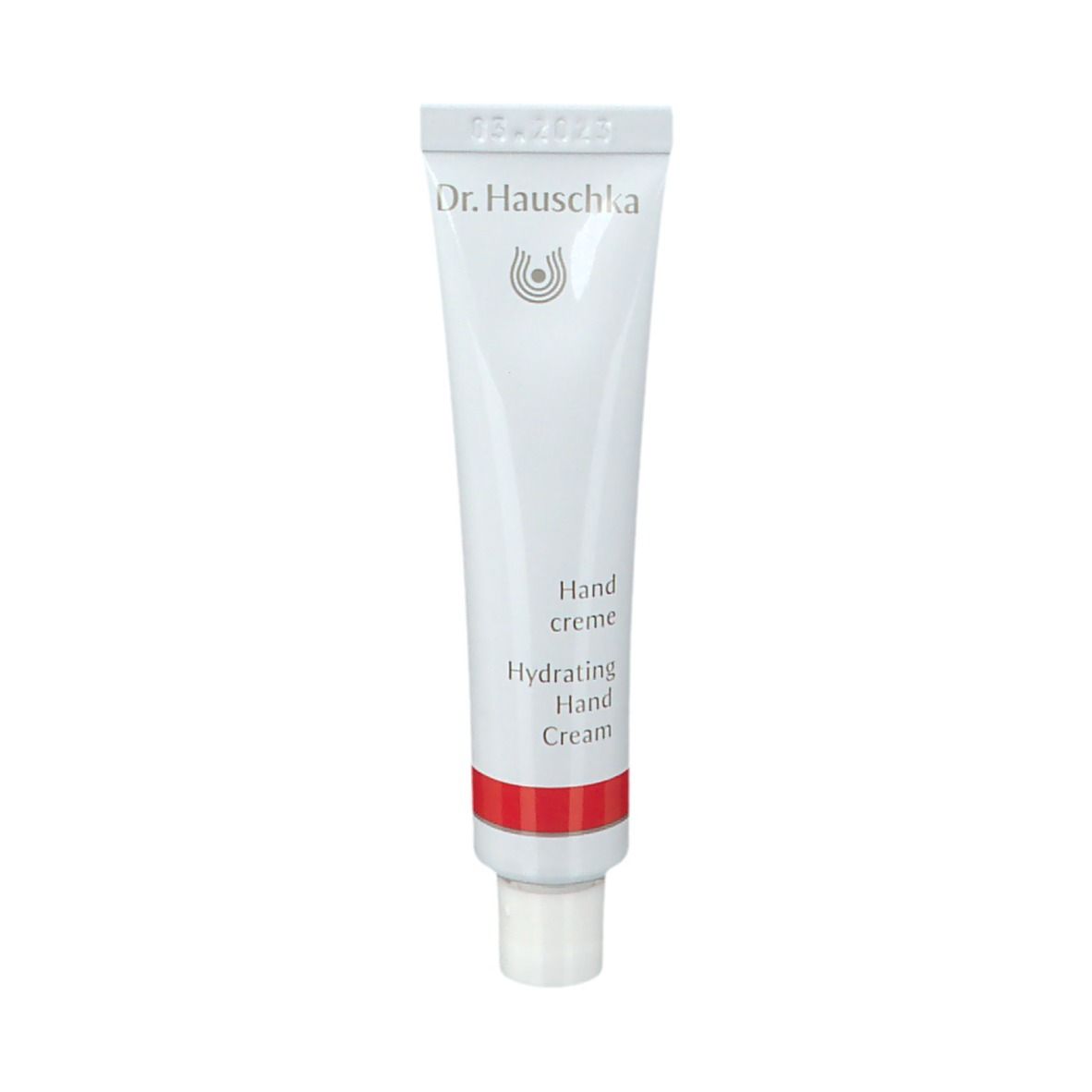Tubo bianco con fascia rossa. Scritta: Dr. Hauschka, Handcreme, Hydrating Hand Cream.