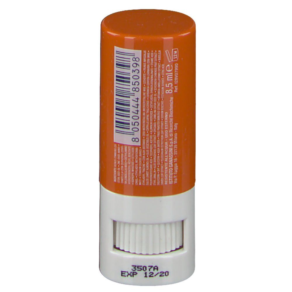 Stick solare arancione e bianco. Retro con codice a barre e testo. Parte inferiore con meccanismo rotante.
