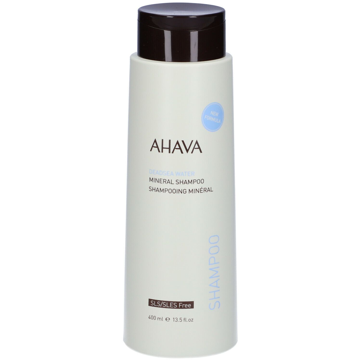 Flacone di shampoo AHAVA Minerale. Flacone verde chiaro con tappo marrone. Scritta AHAVA e Shampoo. Senza SLS/SLES.