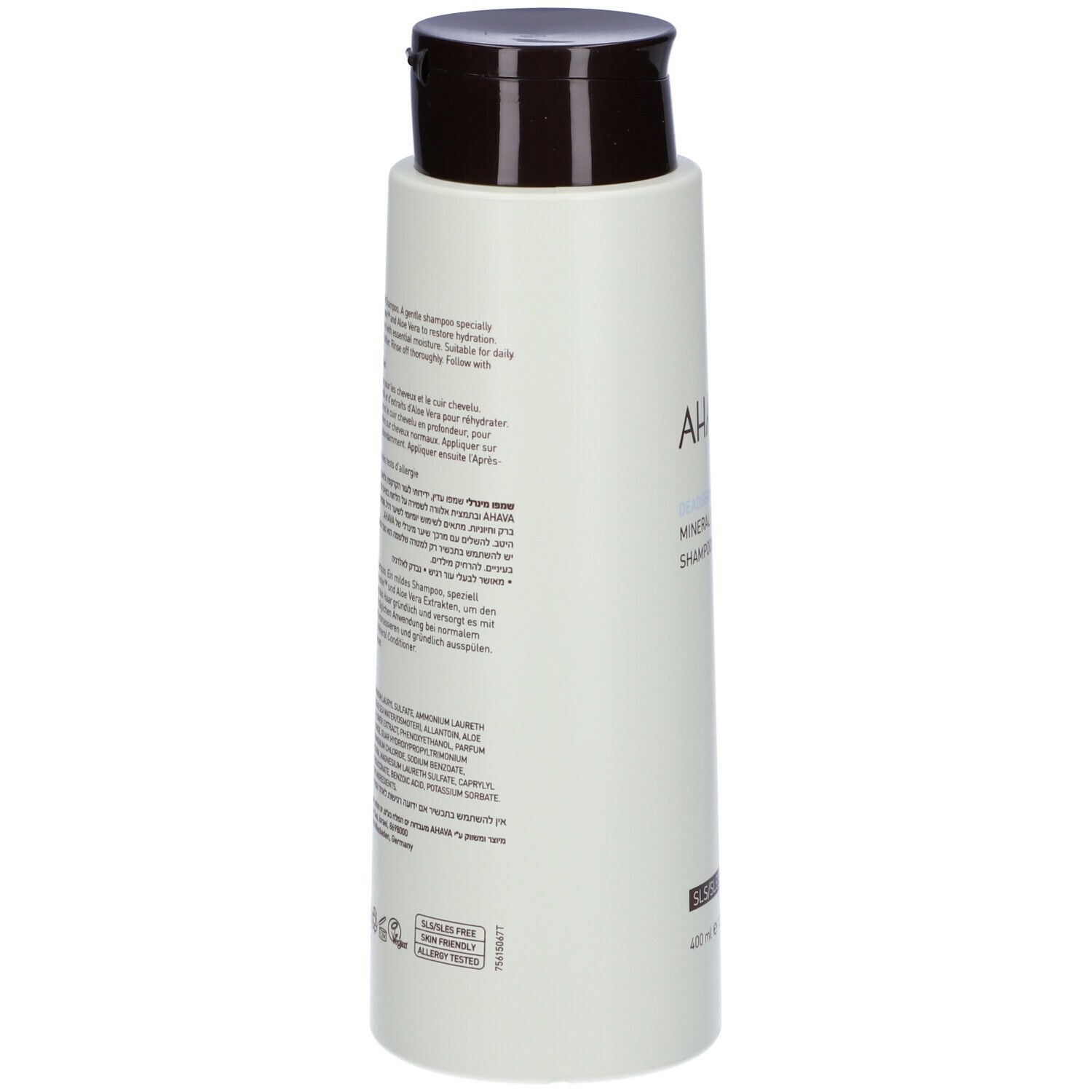 Retro del flacone di shampoo AHAVA Minerale. Flacone verde chiaro con tappo marrone. Testo multilingue.