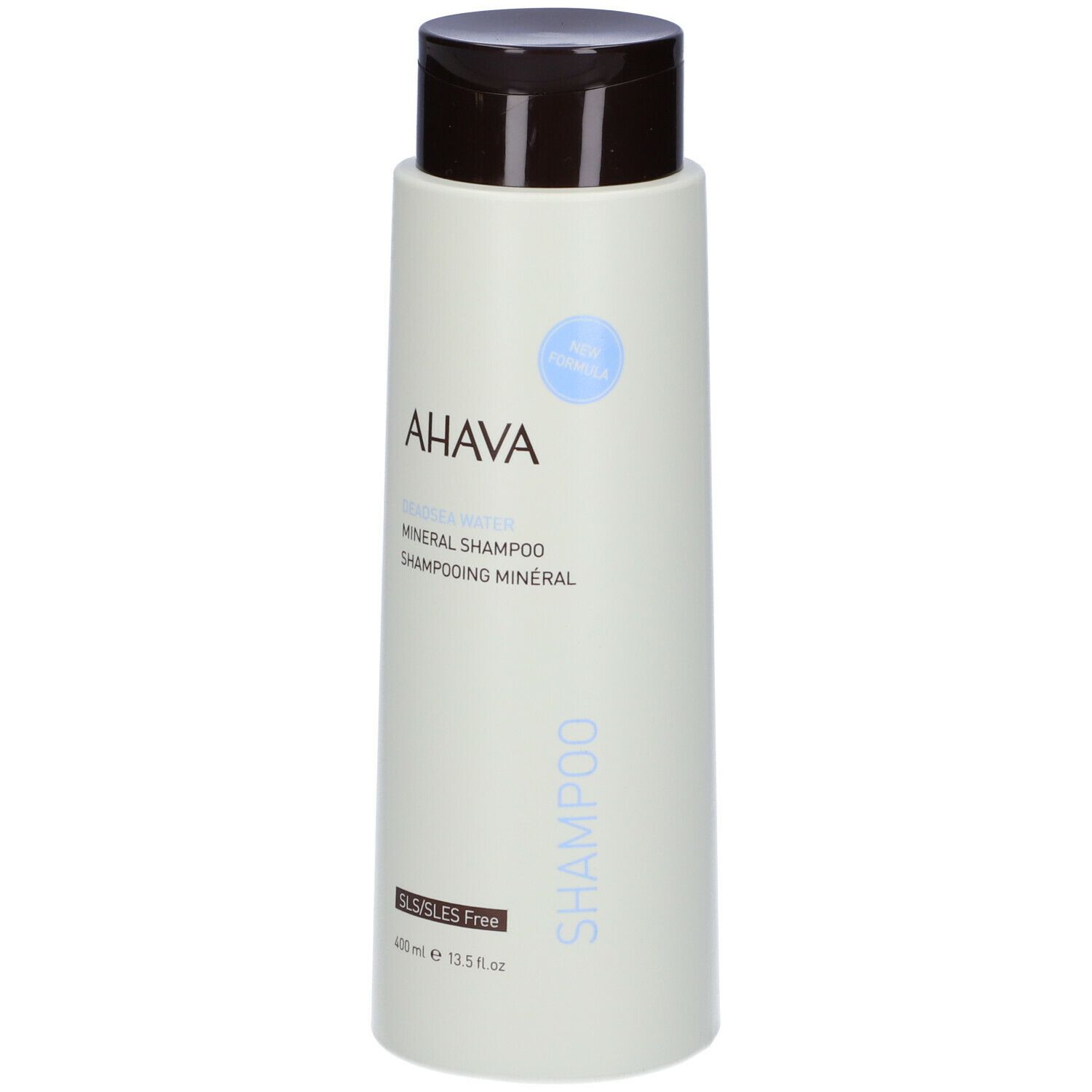 Flacone di shampoo AHAVA Minerale. Flacone verde chiaro con tappo marrone. Scritta AHAVA e Shampoo. Senza SLS/SLES.