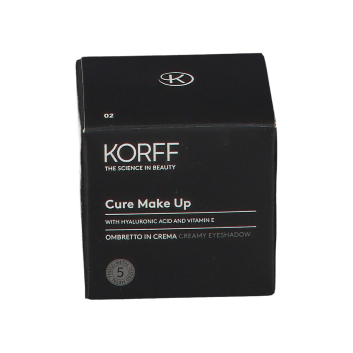 Confezione nera per ombretto in crema KORFF. Testo: KORFF, CURE MAKE UP, Ombretto in Crema. Con acido ialuronico e vitamina E.