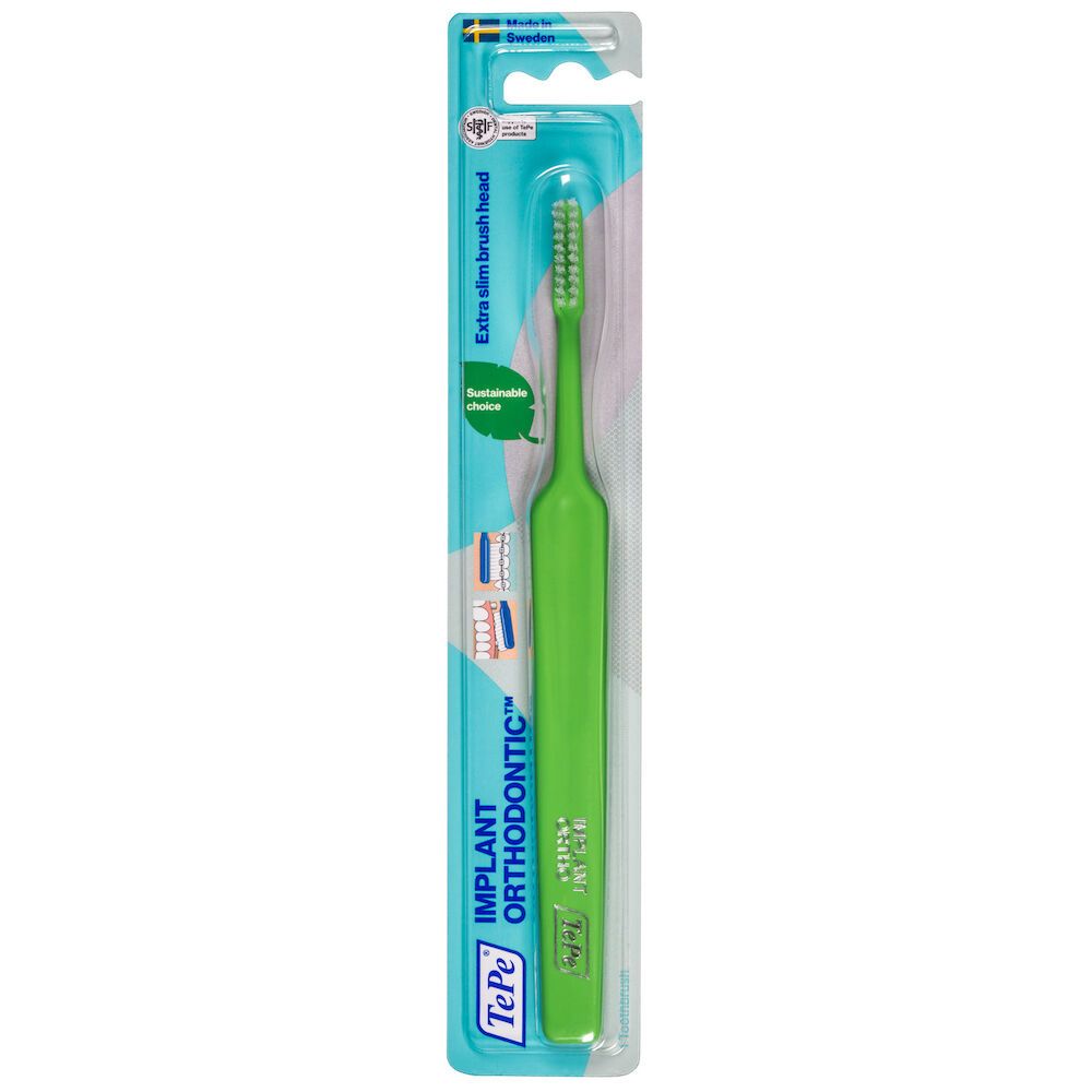 Spazzolino verde con testina sottile, confezione blister. Scritta: Implant Orthodontic.