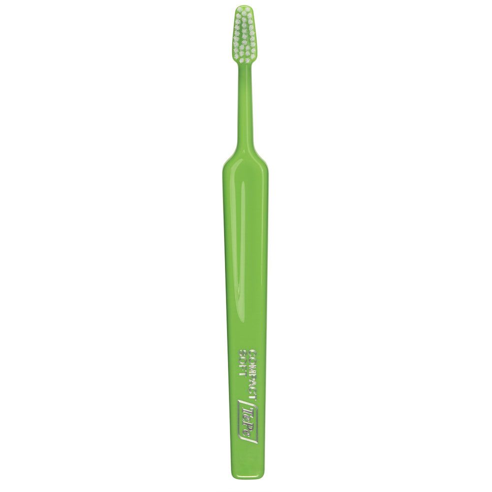 Spazzolino verde, setole verde chiaro. Manico sottile, testina compatta.